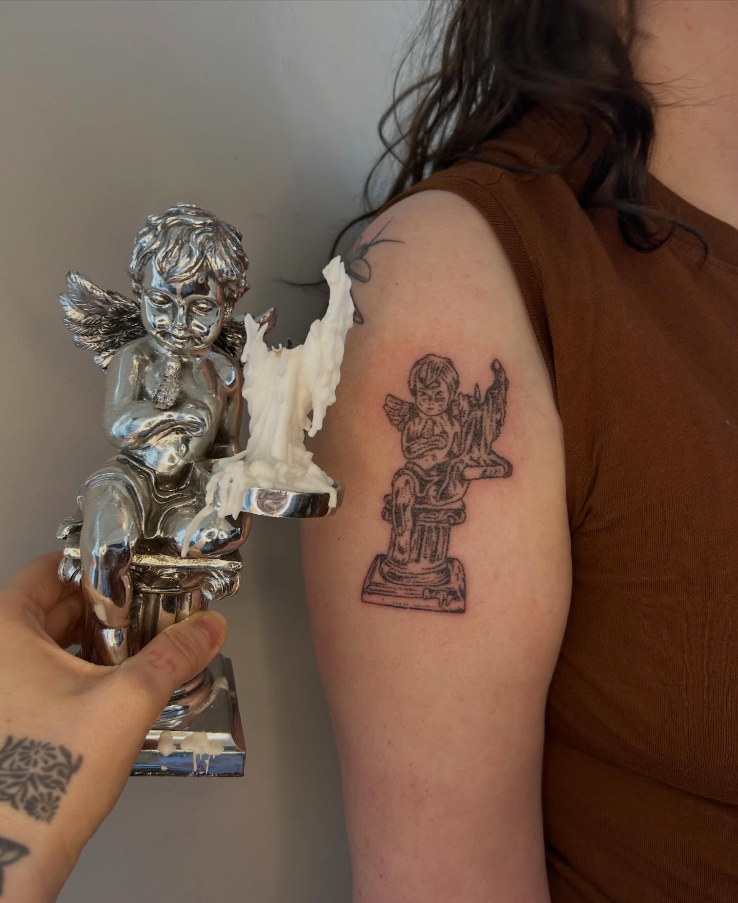 Angel statue black and grey tattoo on the upper arm by ˙⋆✮⋆˙‧₊˚✧ sophie ✧˚₊‧˙⋆✮⋆˙