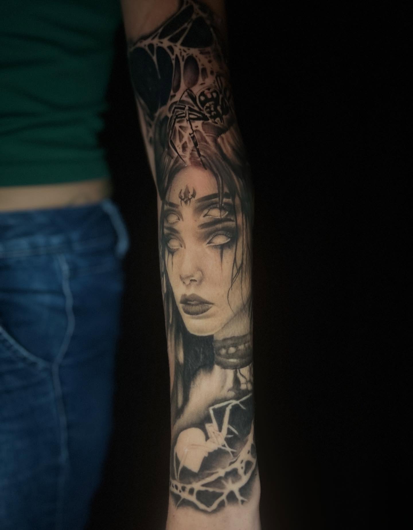 Woman's face realism tattoo on the forearm by Mayhem Andrews