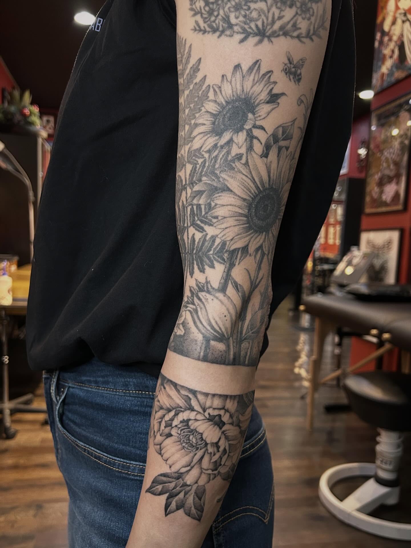 Sunflowers and roses realism tattoo on the forearm by Tako, Seattle, Washington