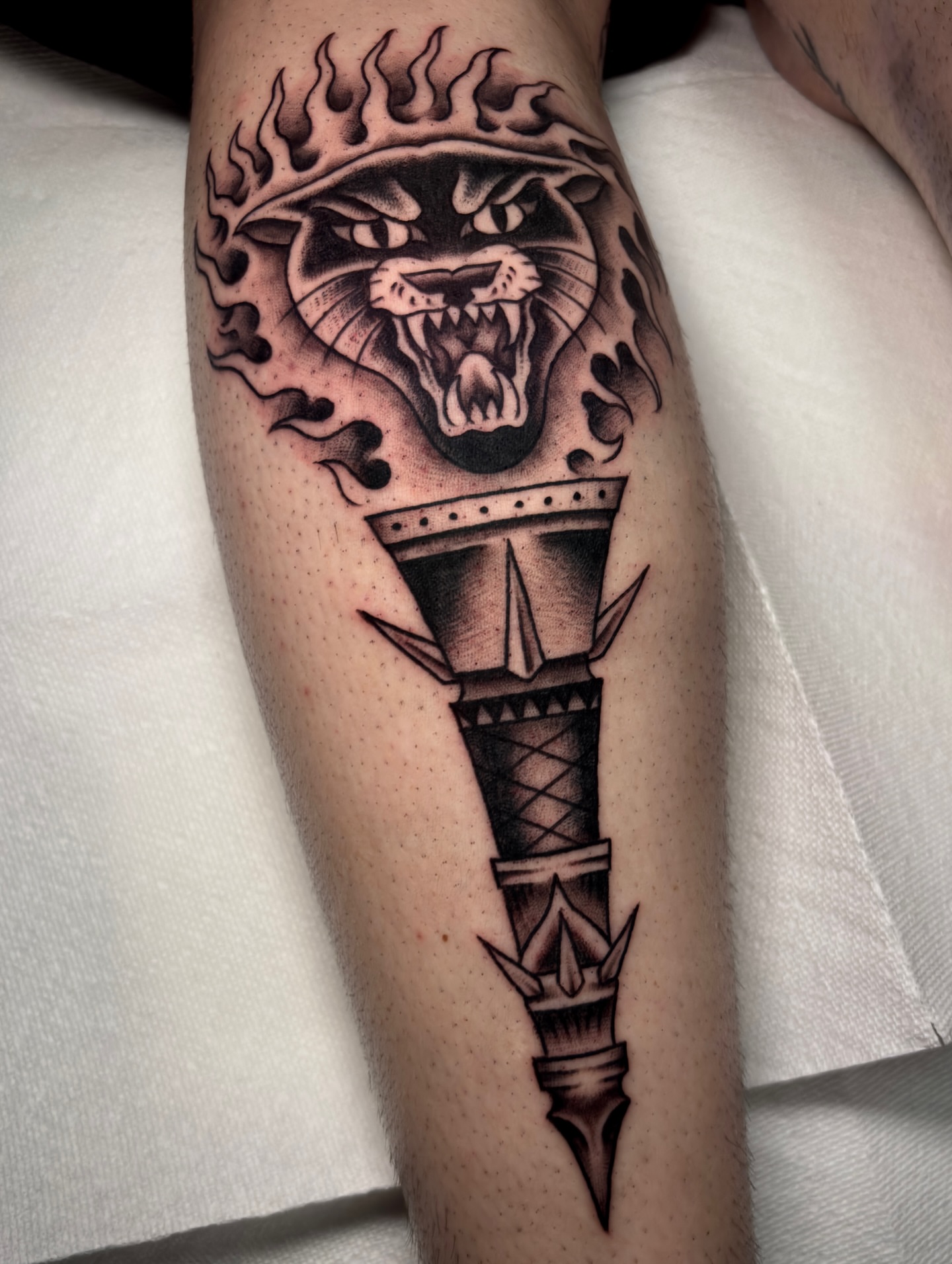 Statue torch with snake geometric tattoo on the forearm by Matt Elliott, Murfreesboro, Tennessee