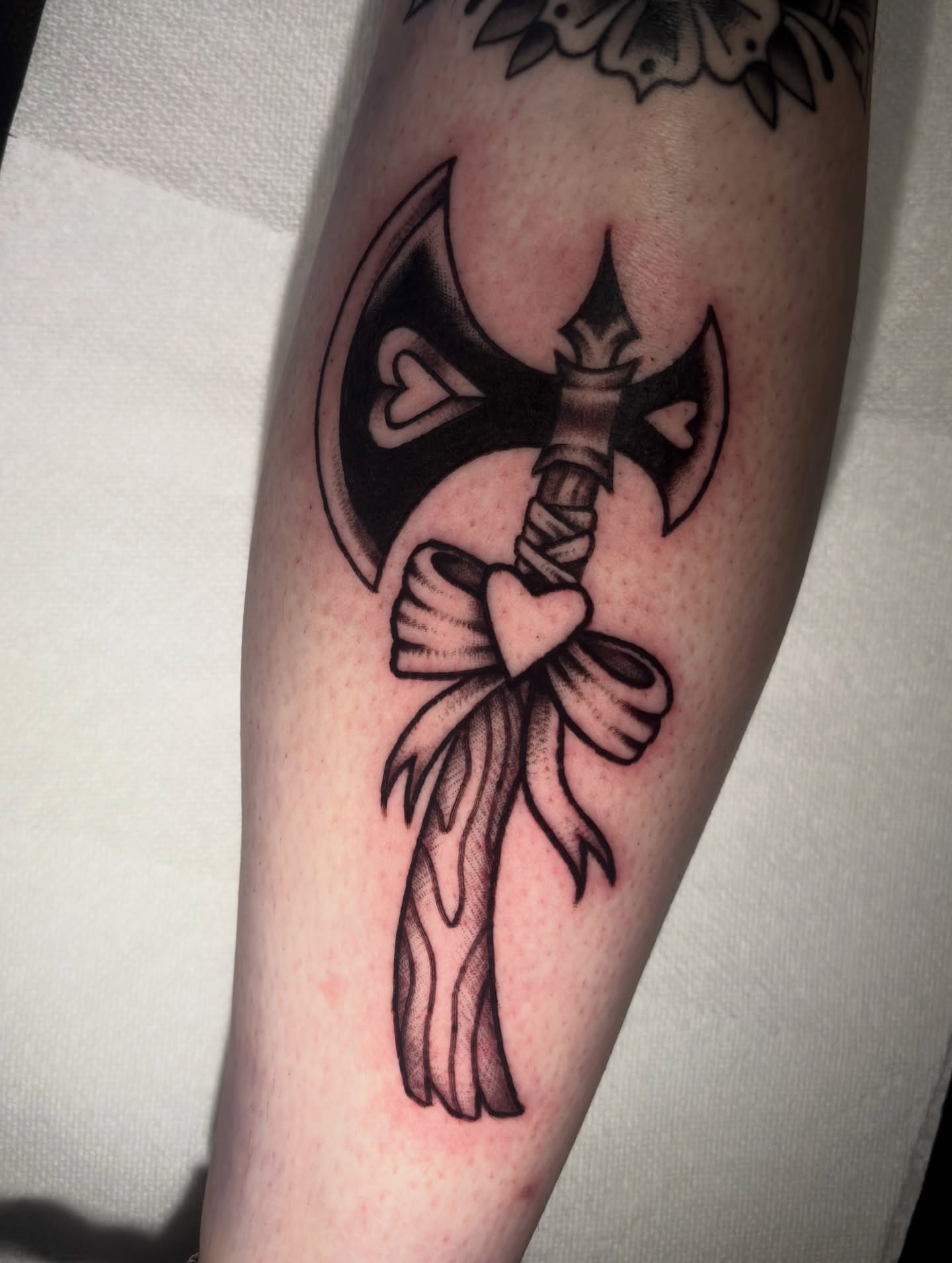 Ax with ribbon black and grey tattoo on the forearm by Matt Elliott, Murfreesboro, Tennessee