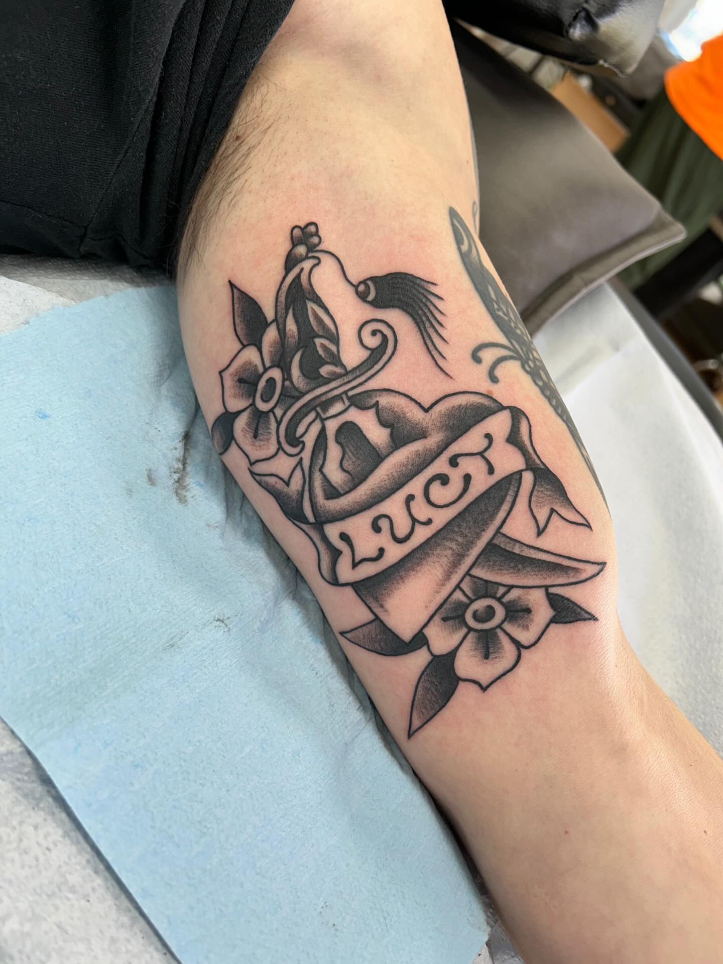 Anchor and ribbon American traditional tattoo on the forearm by Matthew Crimson