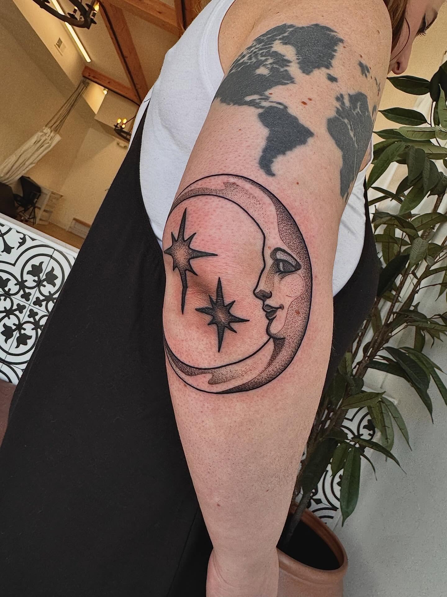 Moon and stars dotwork tattoo on the forearm by Stefany