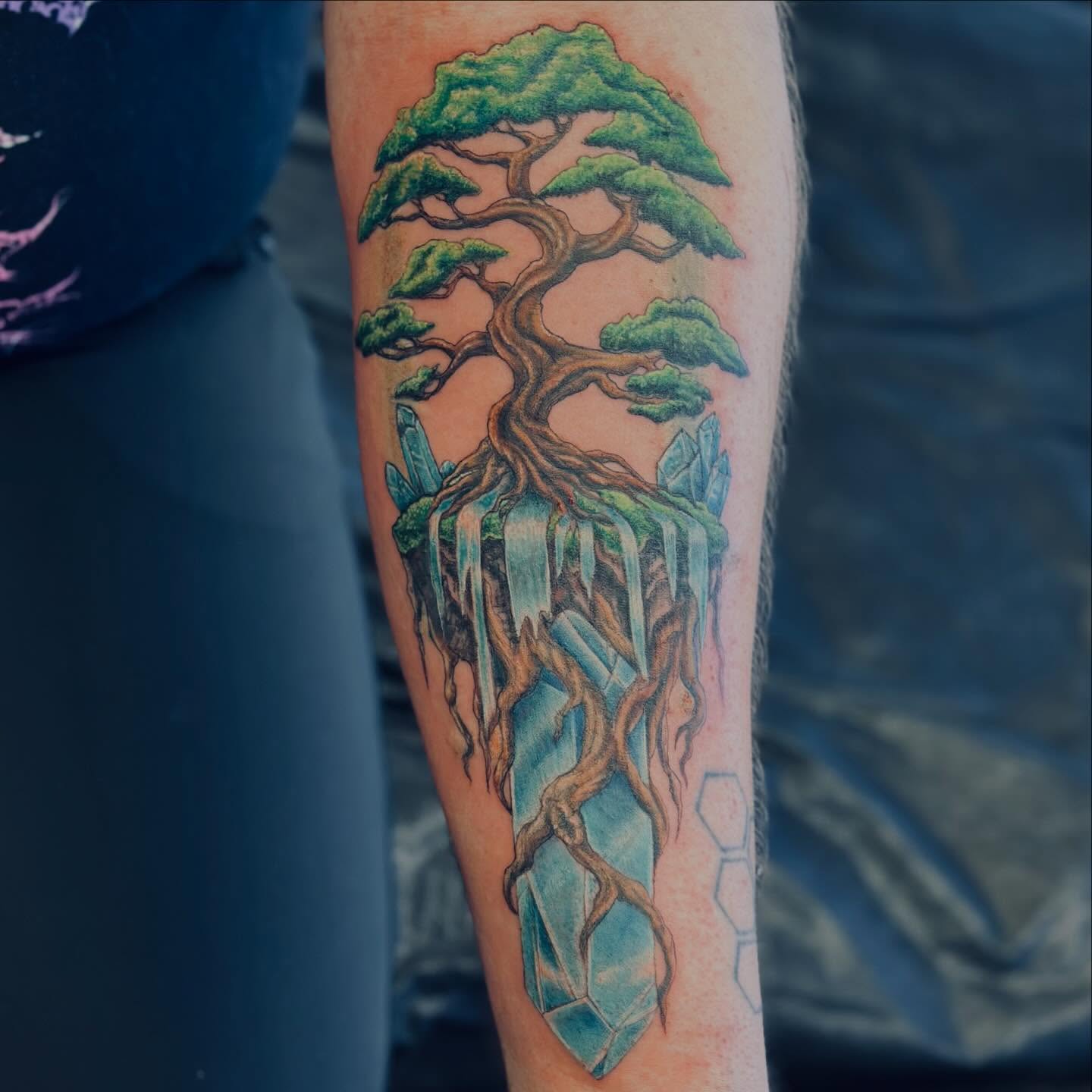 Tree with crystals realism tattoo on the forearm by Teddi Bird