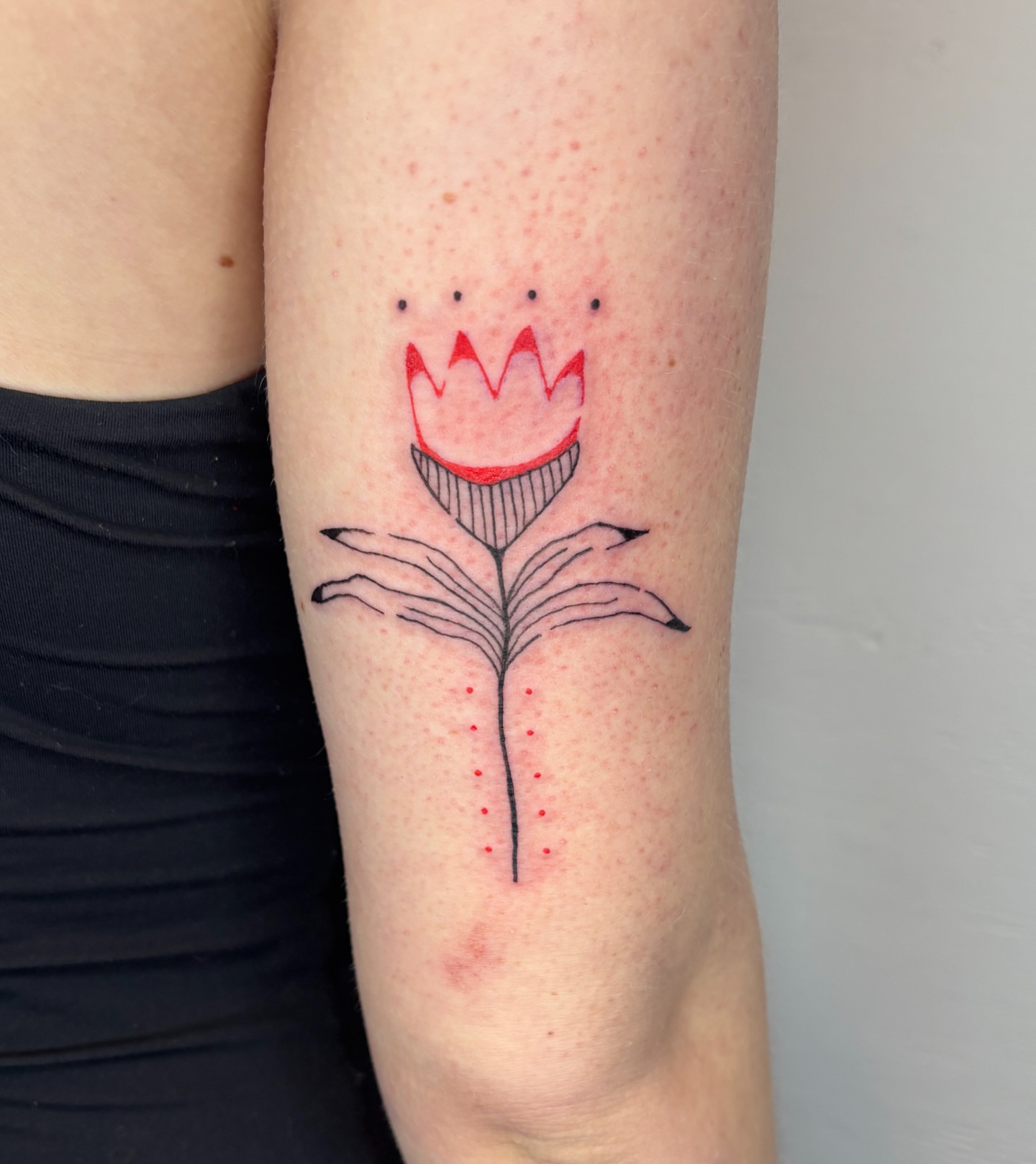 Flower dotwork tattoo on the forearm by Raye