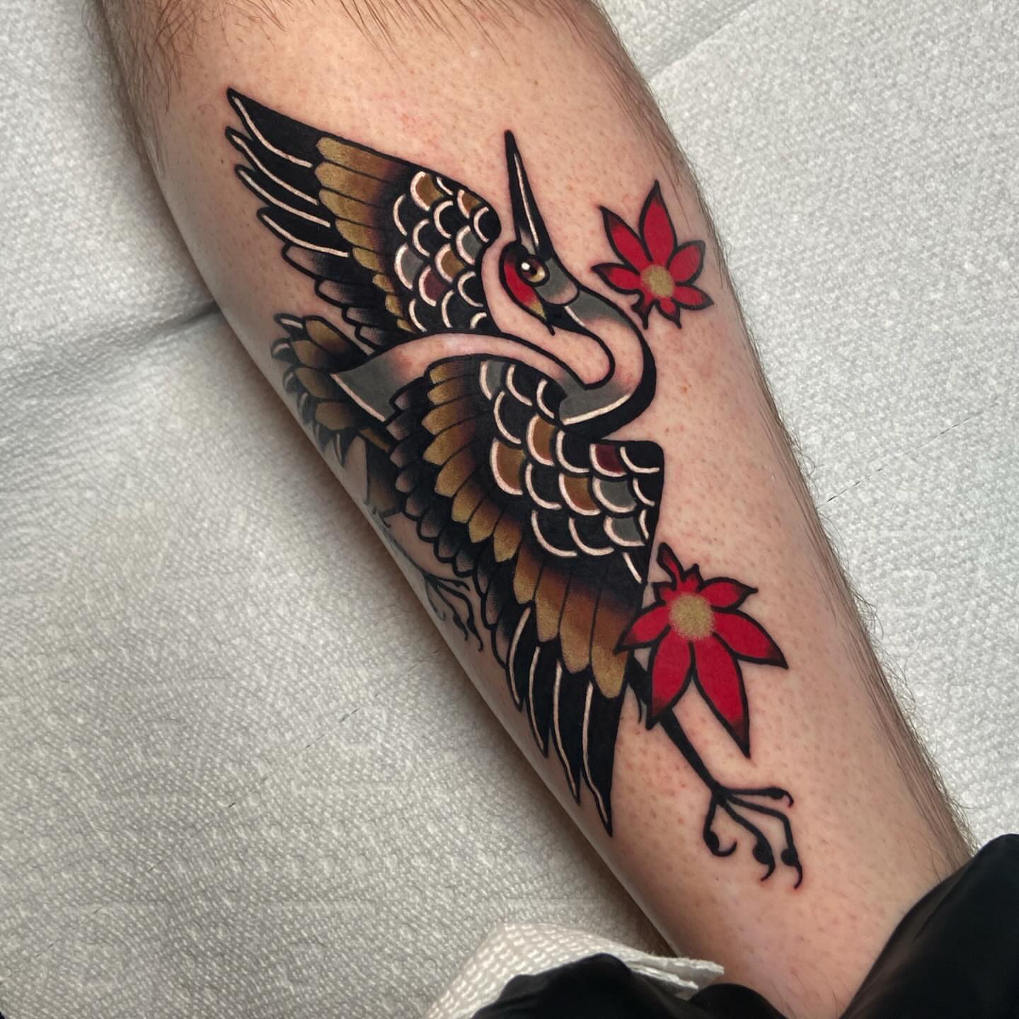 Crane and flowers American traditional tattoo on the forearm by Matthew Limbers⚜️