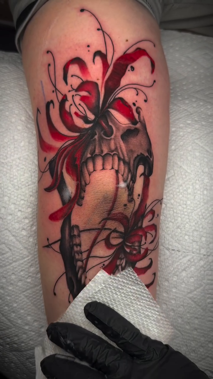 Skull with chrysanthemum dark realism tattoo by Denver Tattoo Artist