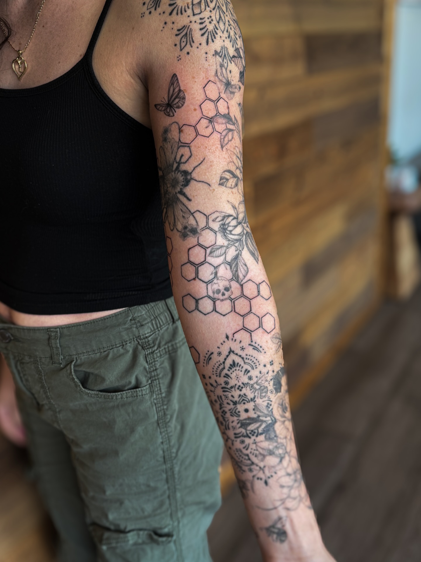 Hexagons and floral geometric tattoo on the forearm by utah tattoo artist