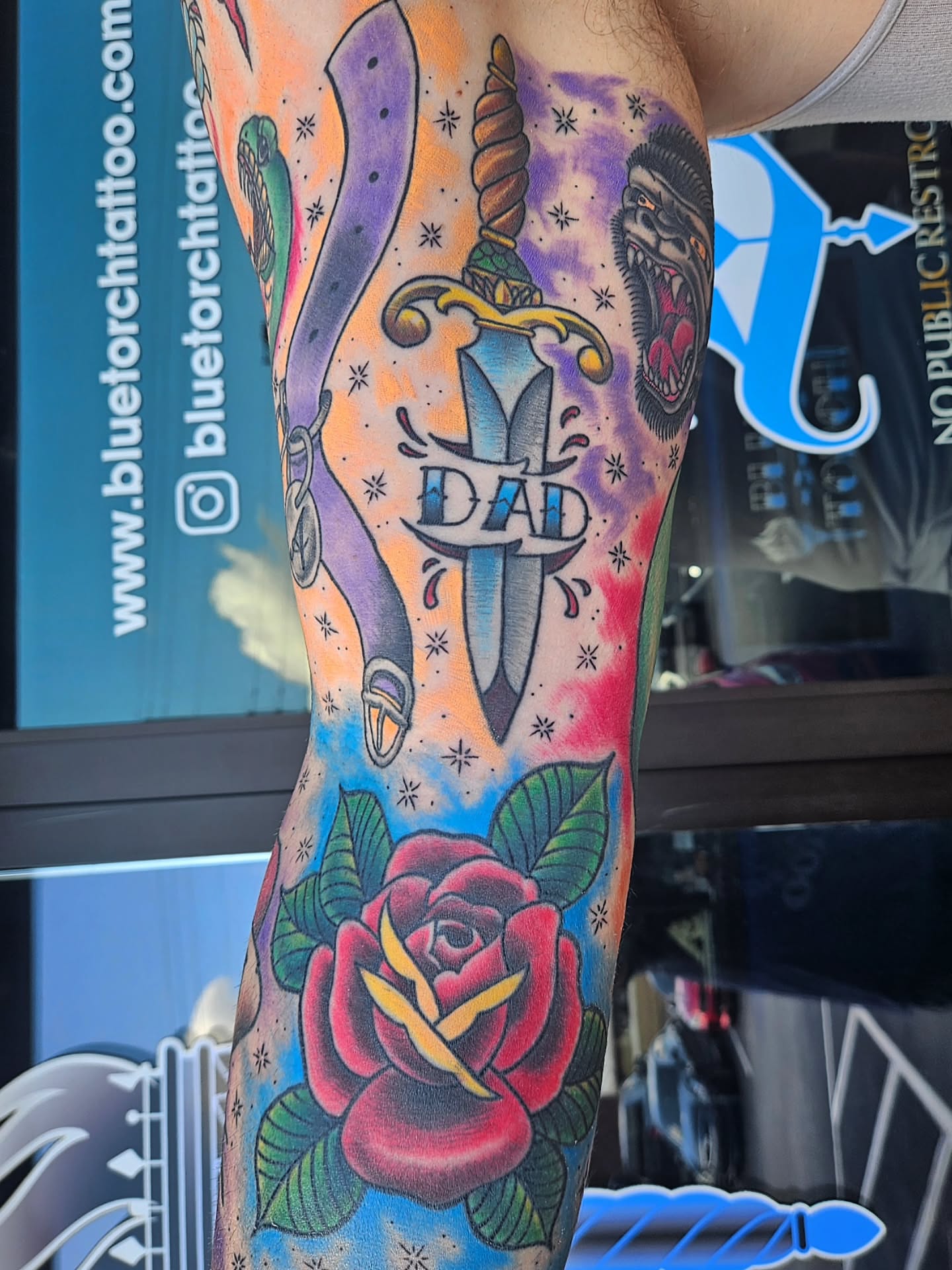 Sword and rose American traditional tattoo on the forearm by Mike Bugenhagen