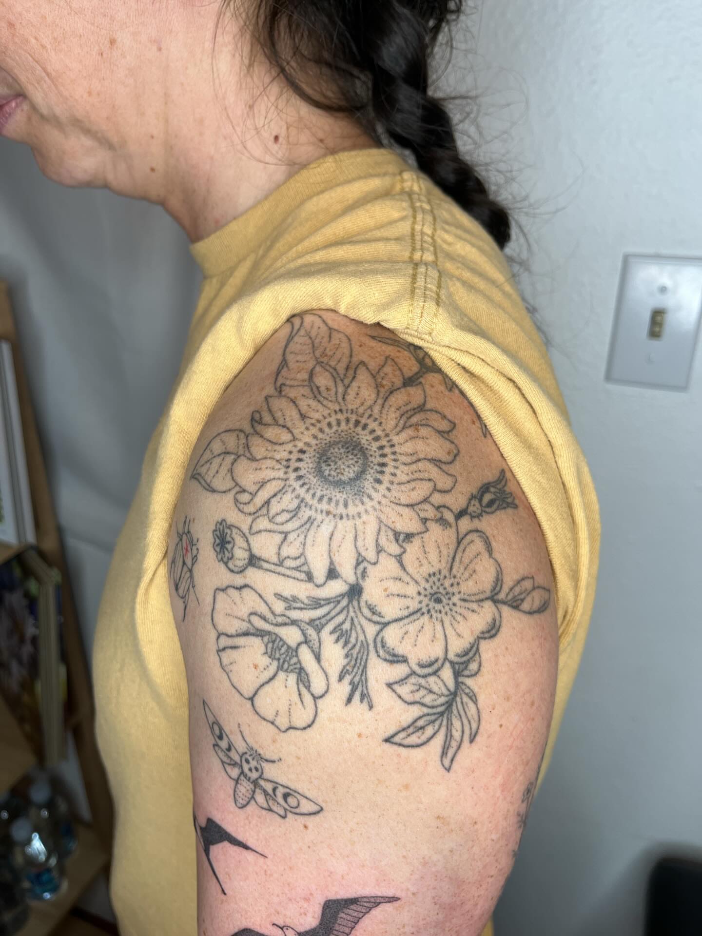 Flower bouquet black and grey tattoo on the shoulder by natalie