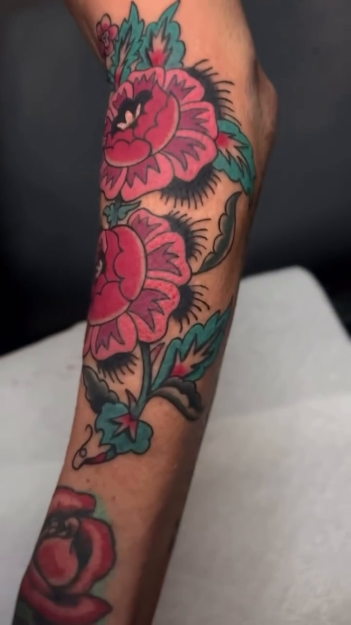 Peonies and leaves tattoo neo-traditional tattoo on the forearm by Bre