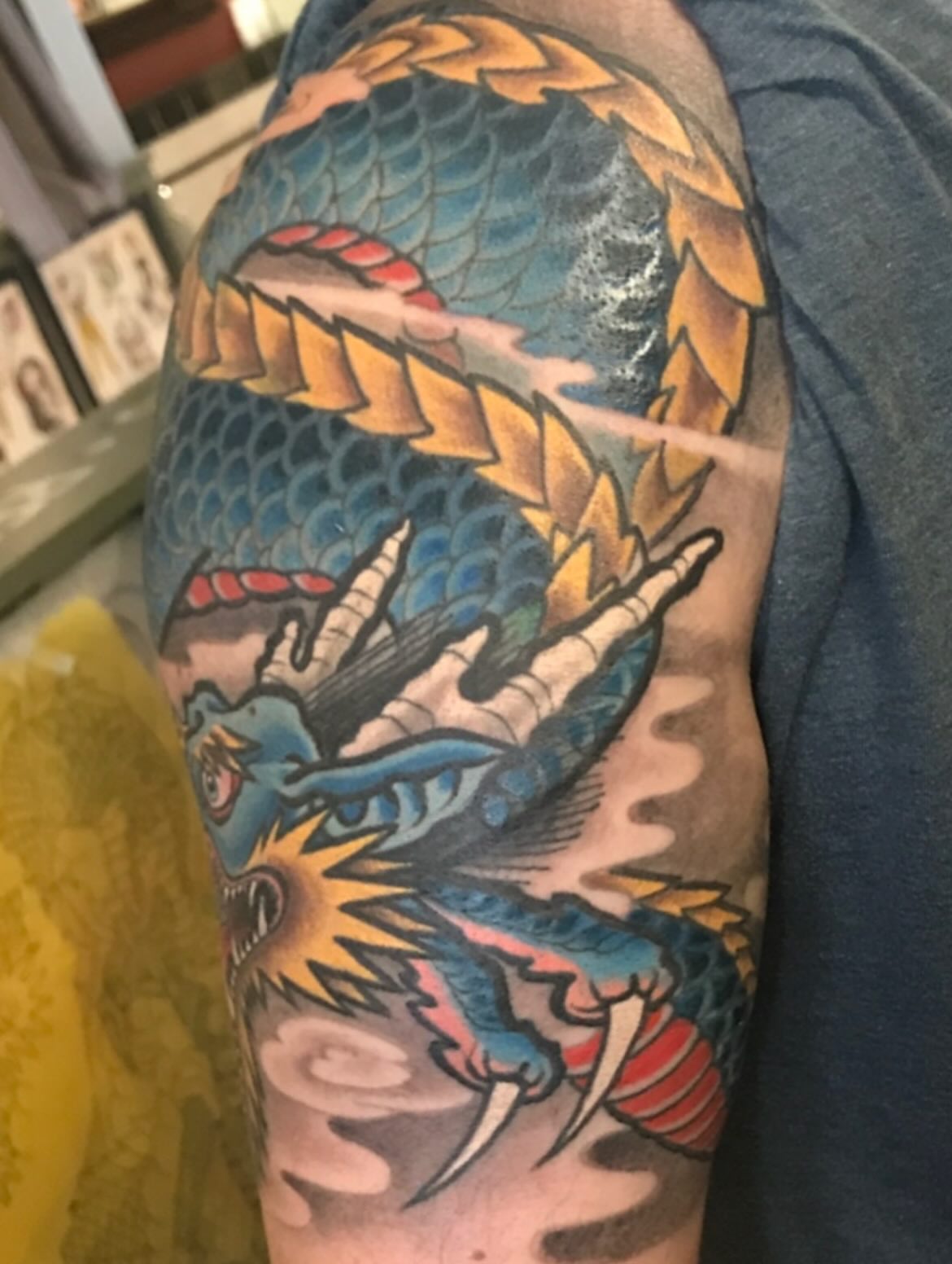 Dragon American traditional tattoo on the upper arm by Miles Maniaci, Chicago, Illinois
