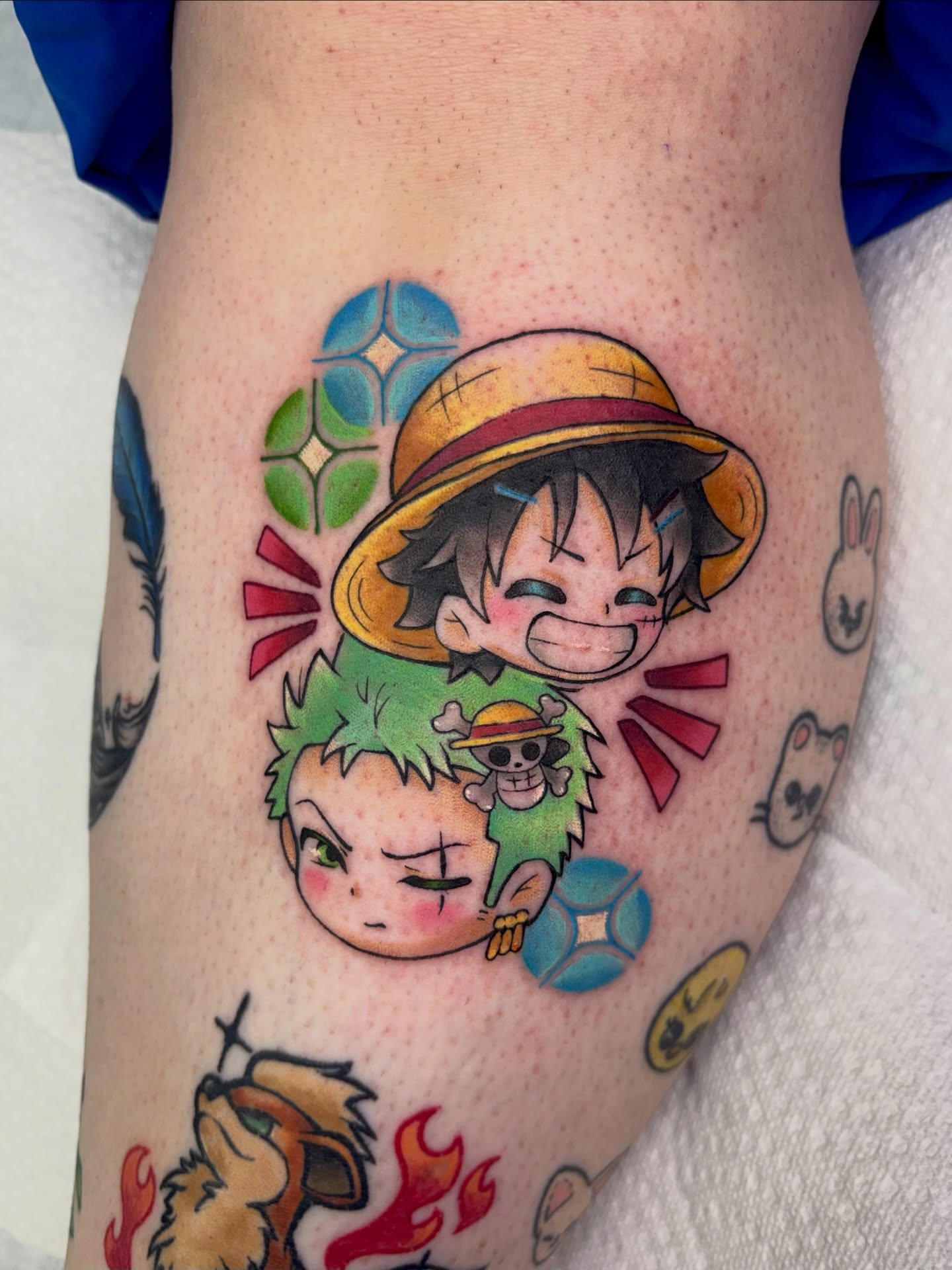 Anime characters anime tattoo on the leg by Lilac Rose