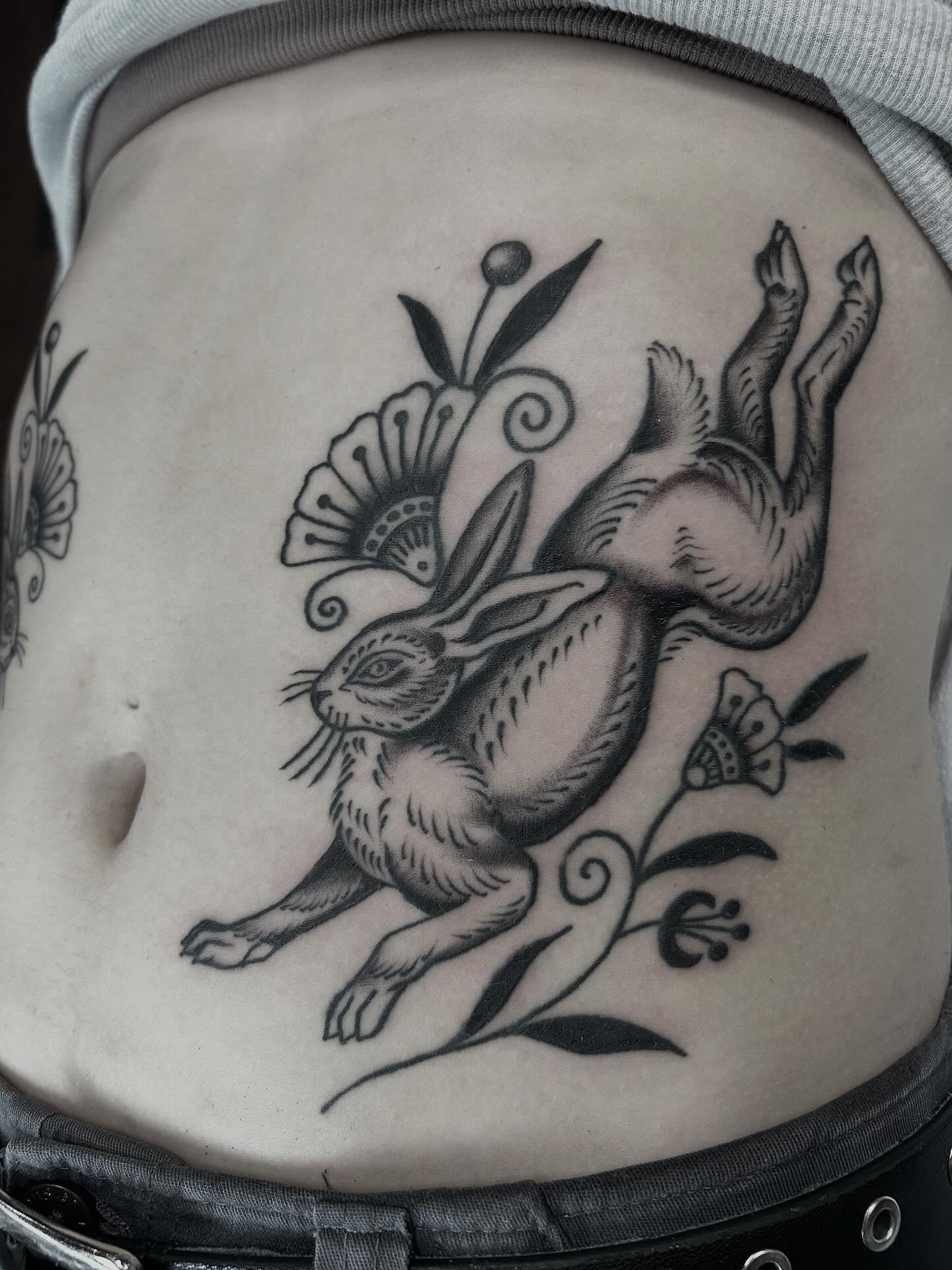 Hopping rabbit black and grey tattoo on the torso by holly danesi . philadelphia tattoo, Philadelphia, Pennsylvania