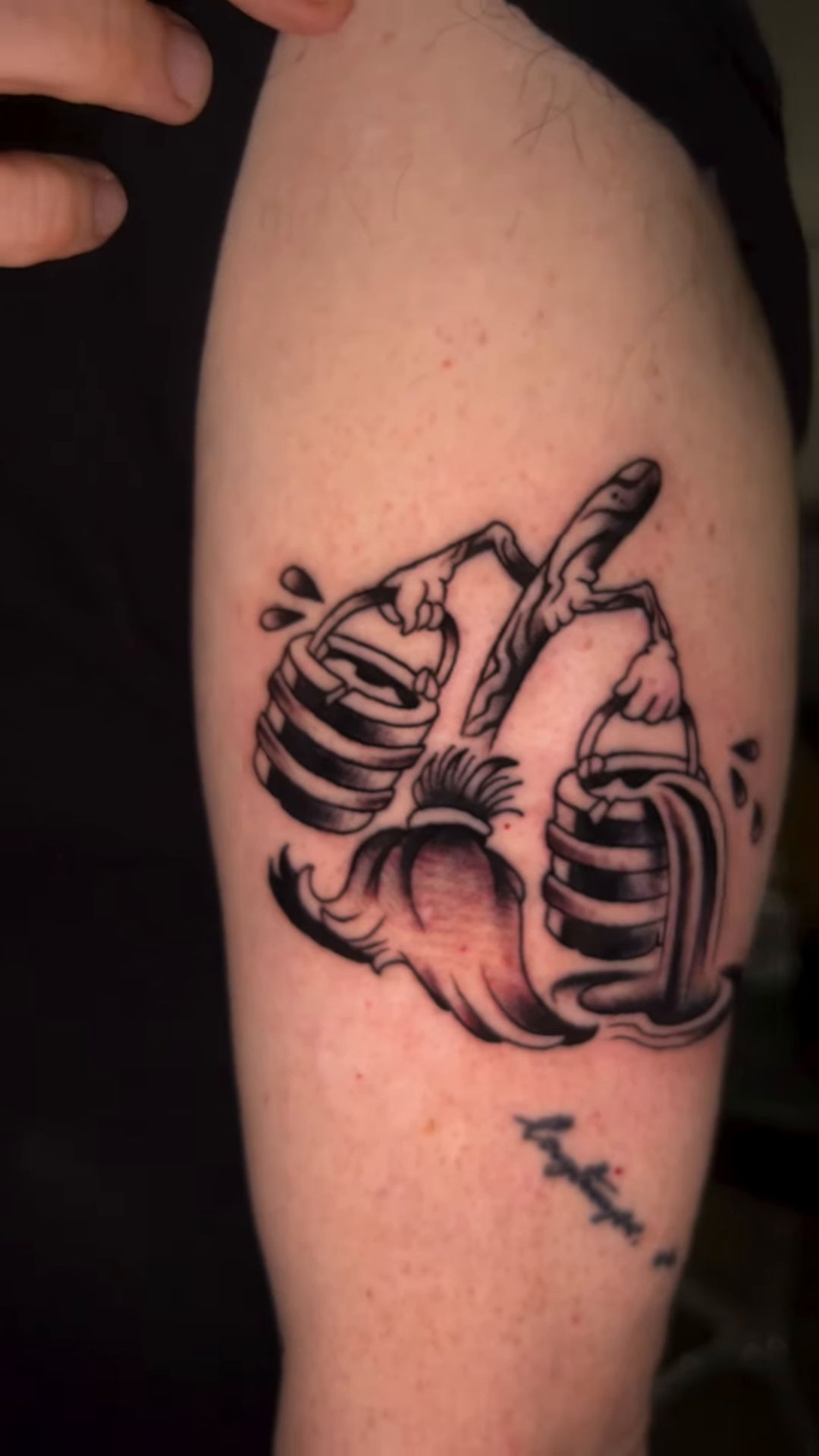 Anatomical heart with waterfall surrealism tattoo on the forearm by Olivia Marie