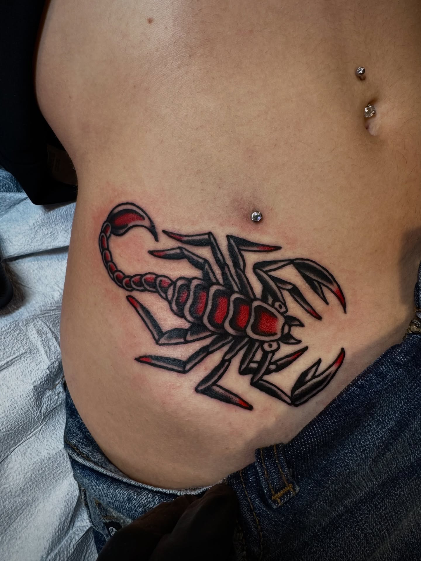 Scorpion American traditional tattoo on the ribs by mike