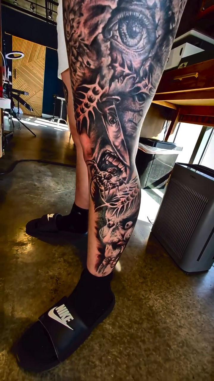 Leg sleeve with skulls and eyes realism tattoo on the leg by Drew King