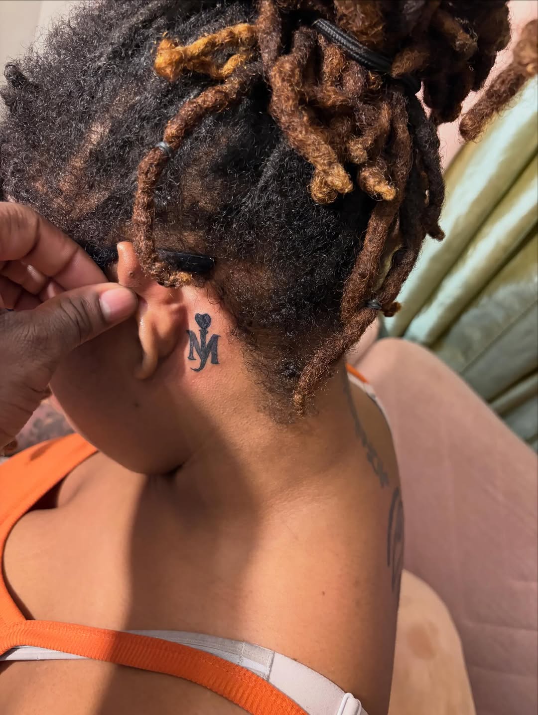 Monogram M tattoo on the neck by Jae the artist🫡