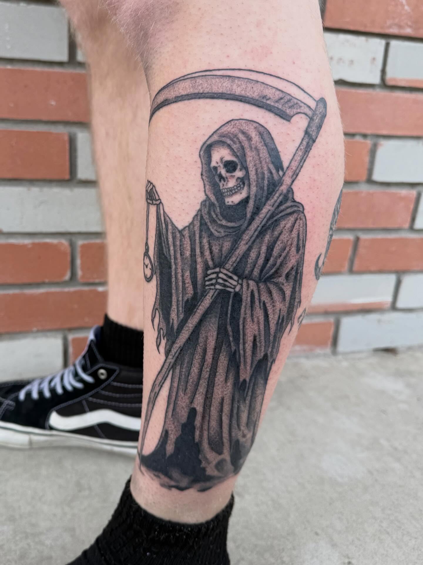 Grim reaper black and grey tattoo on the calf by Elena