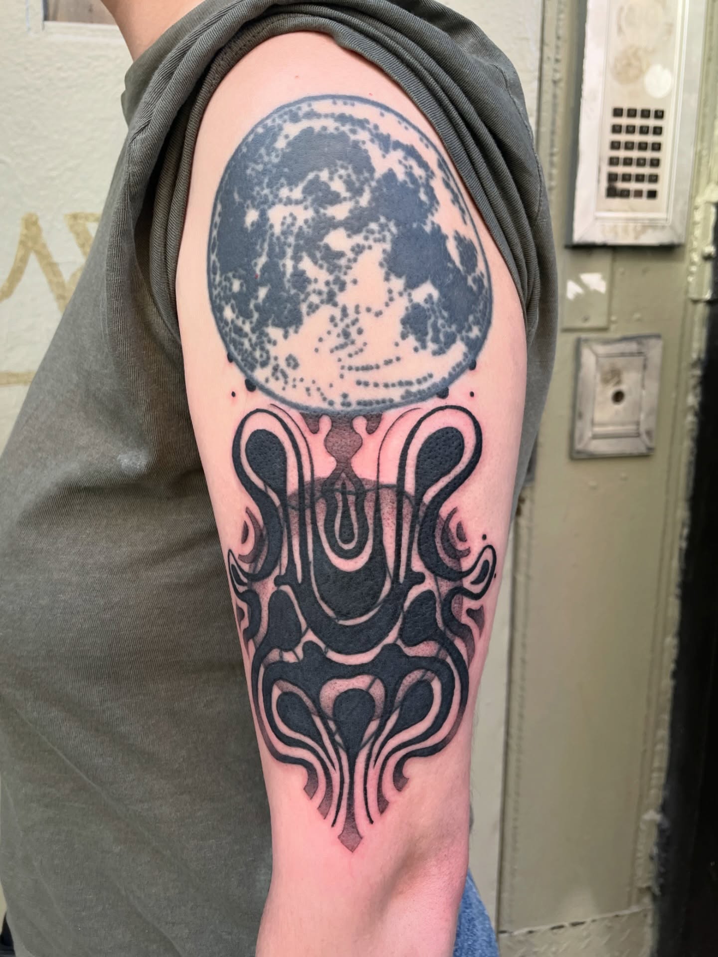 Moon and abstract design geometric tattoo on the forearm by Sylvie
