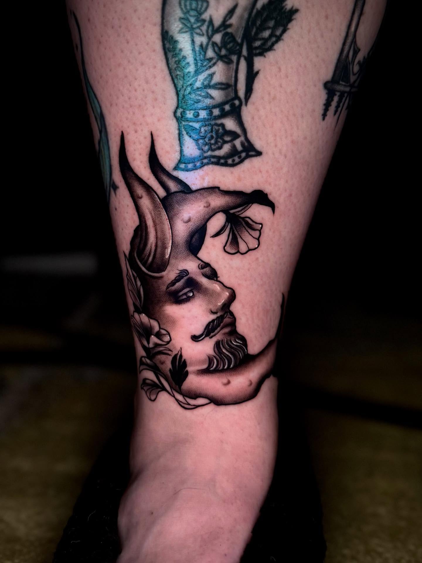 Man's face American traditional tattoo on the forearm by Penny - Tattooer