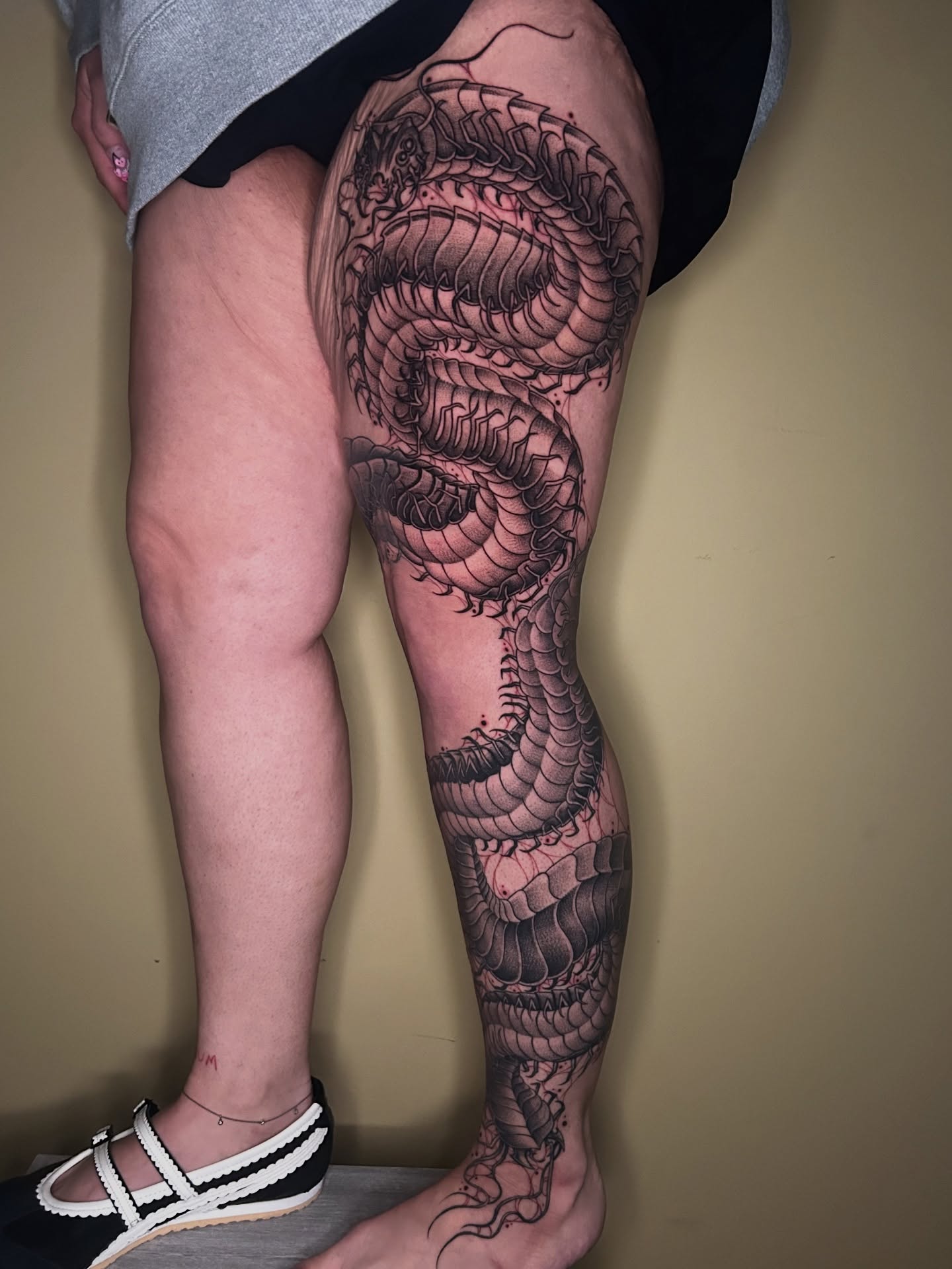 Dragon realism tattoo on the thigh by Cassy D, Miami, Florida