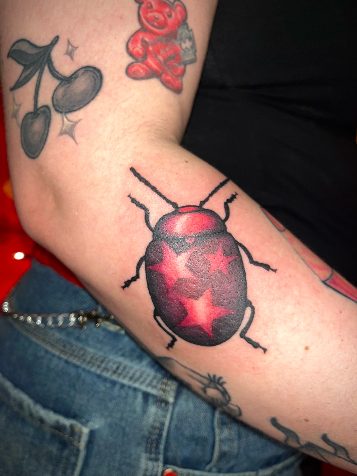 Bug with stars realism tattoo on the forearm by Zoe Phan, Richmond, Virginia