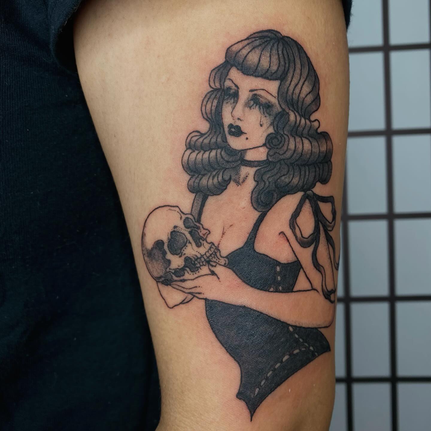 Woman with skull American traditional tattoo on the forearm by sarah 🗝️