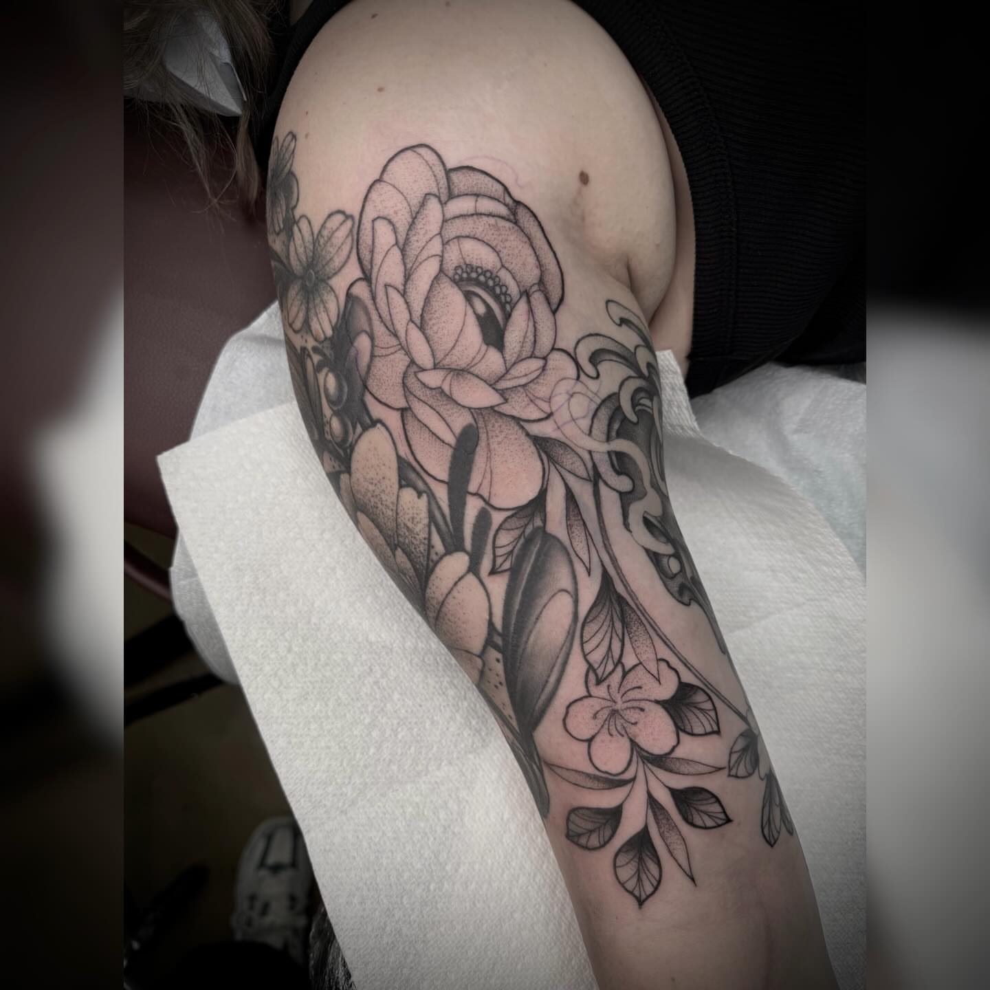 Floral bouquet dotwork tattoo on the forearm by Alyssa Deeghan