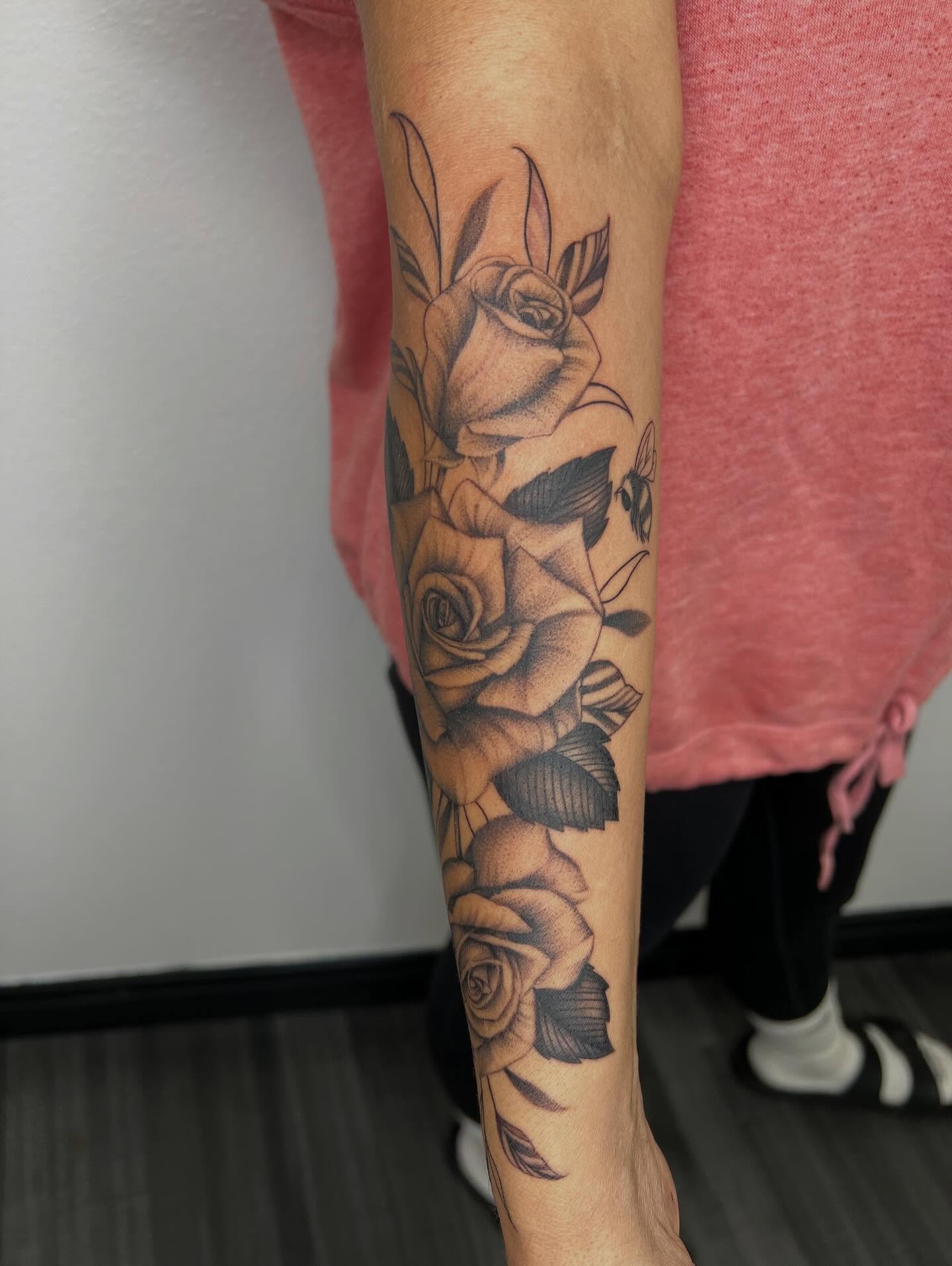 Roses black and grey tattoo on the forearm by San Diego Fineline Black & Grey Tattoo Artist