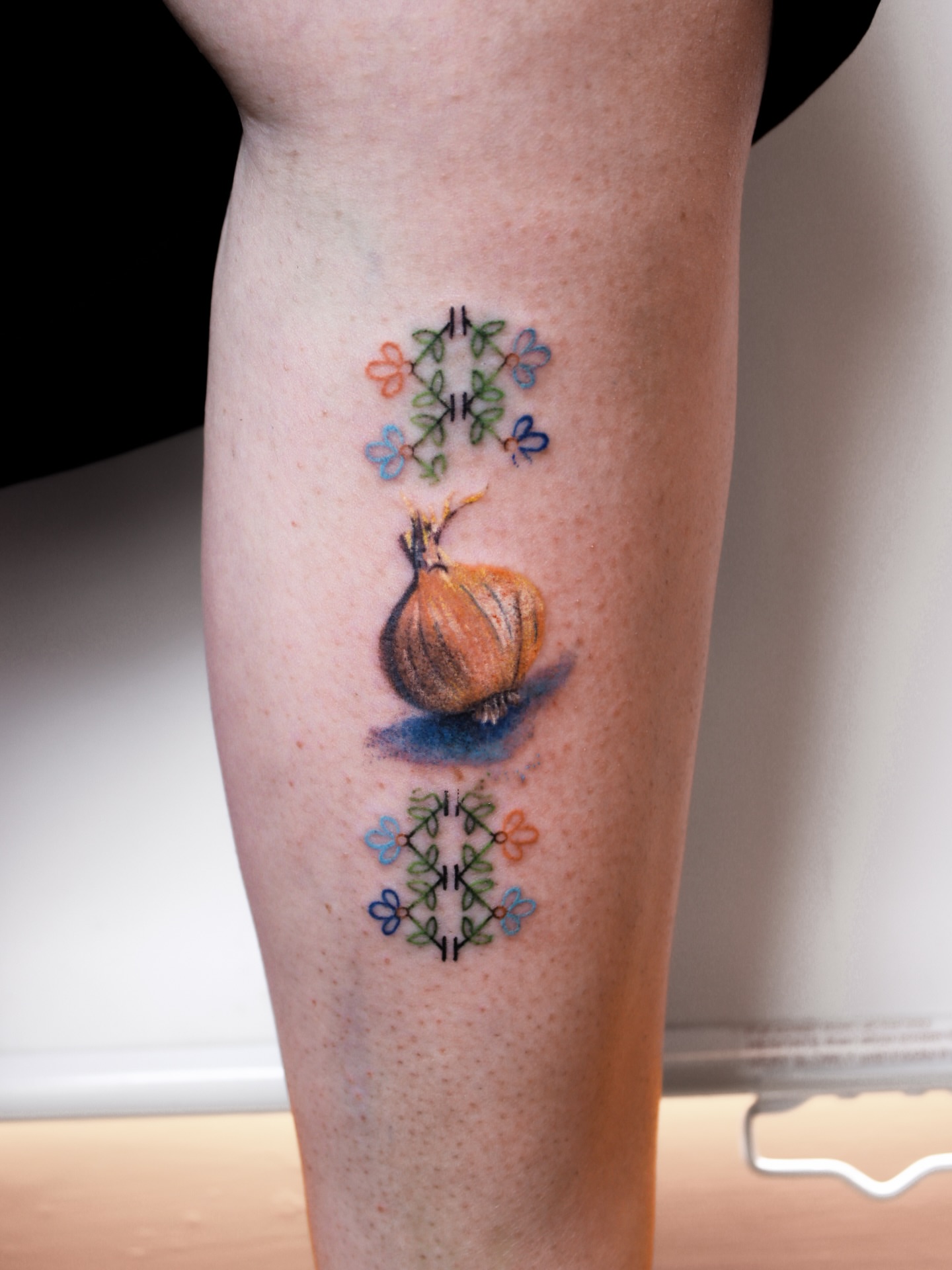 Onion realism tattoo on the forearm by Micah Light (color micro realism, Los Angeles, California