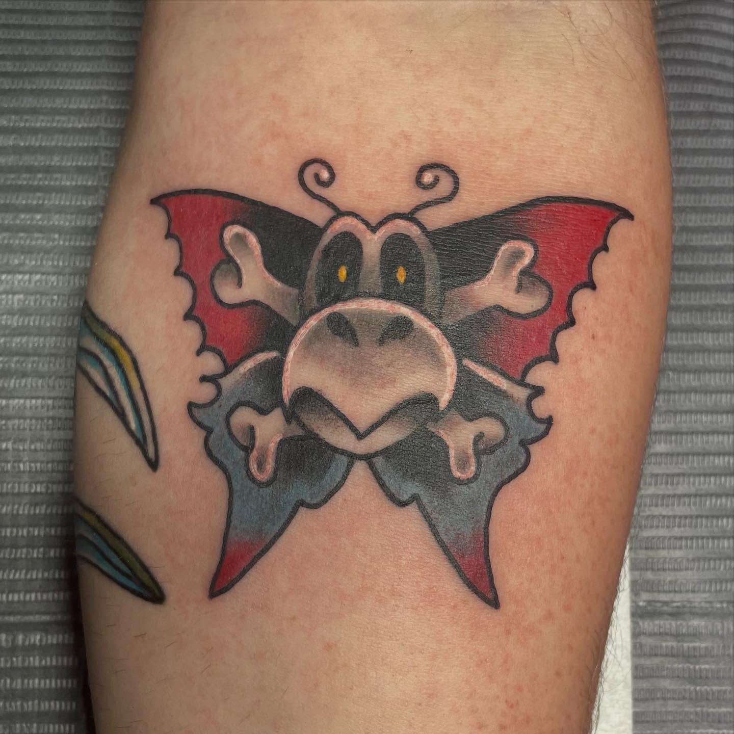 Bat American traditional tattoo on the forearm by Robert Morrow