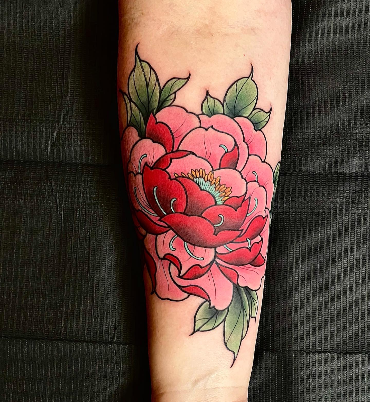 Peony American traditional tattoo on the forearm by Byron Winkelman, Gilbert, Arizona