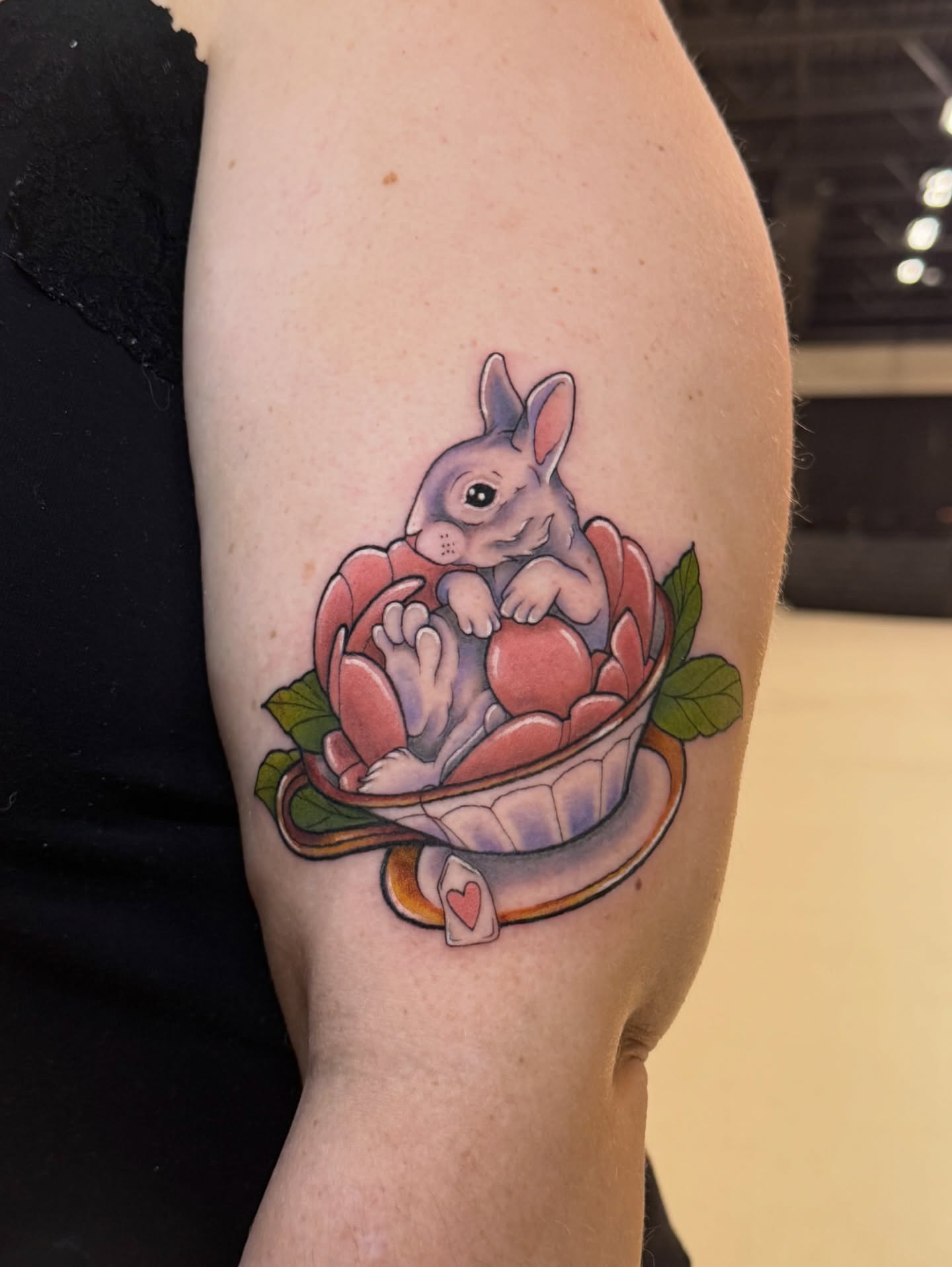 Rabbit in teacup new school tattoo on the forearm by Kelsey Zussman