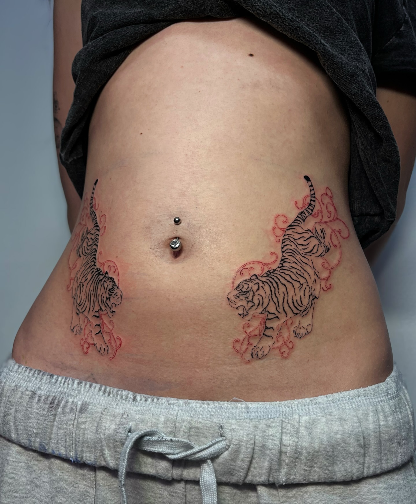 Tigers black and grey tattoo on the torso by MK