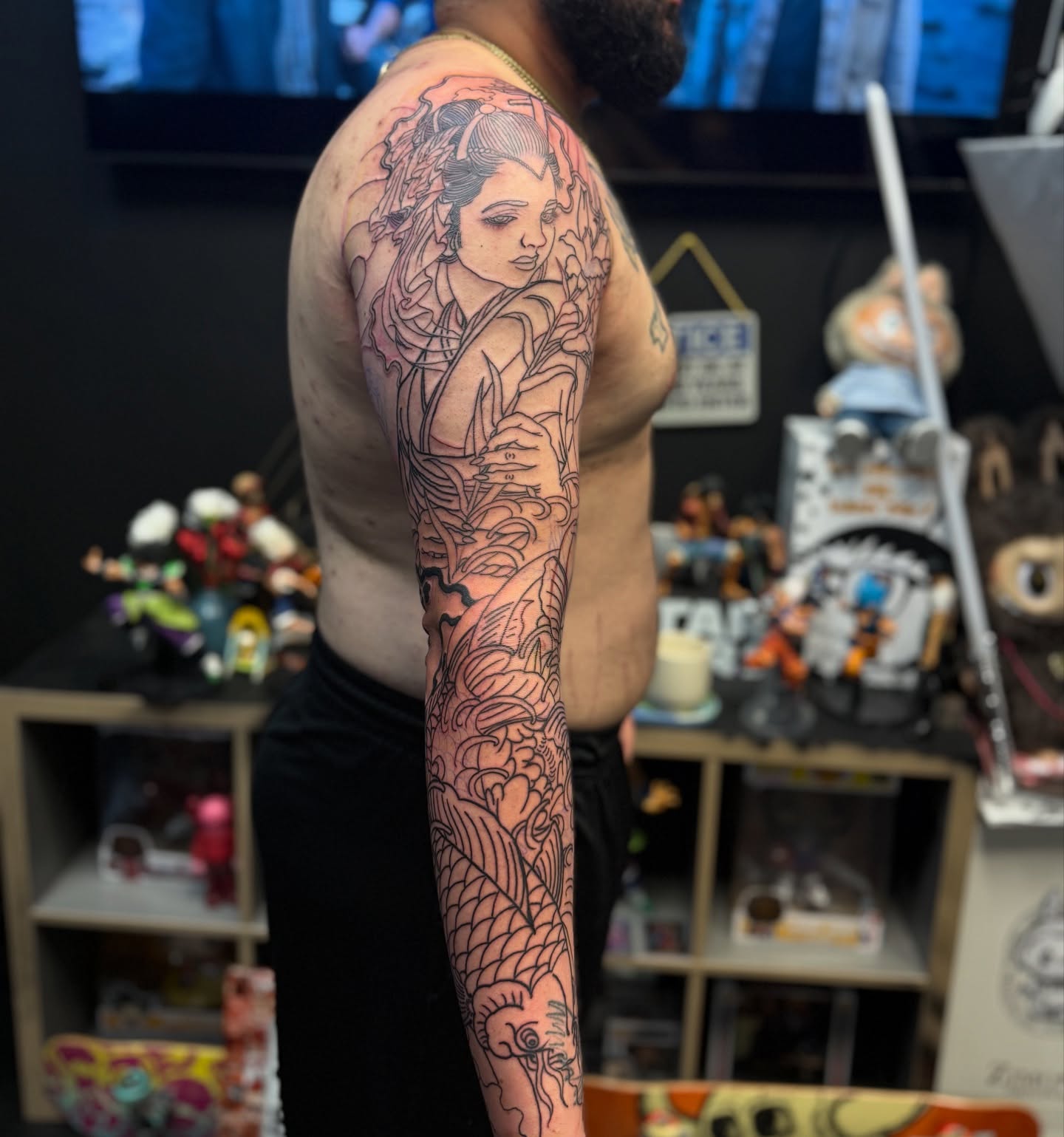 Woman with dragon japanese irezumi tattoo on the upper arm by Zack Yang, Houston, Texas