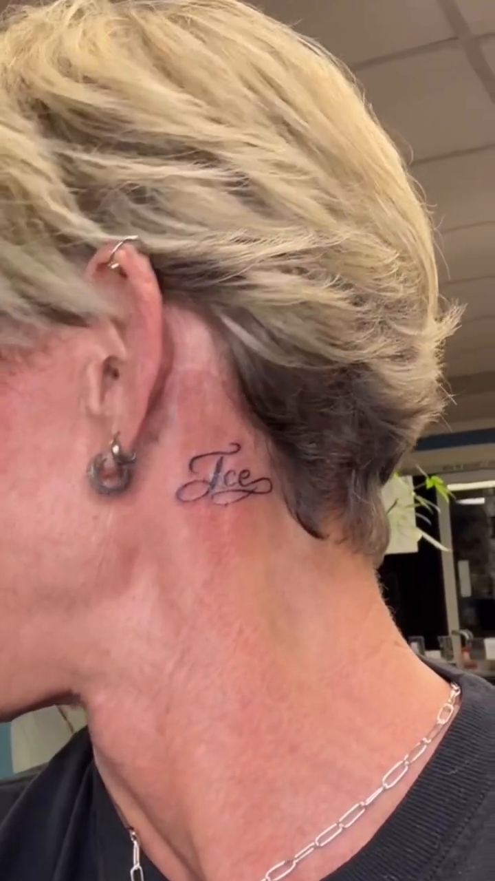 Neck tattoo of the word 'Jae' lettering tattoo on the neck by Jason Topliss