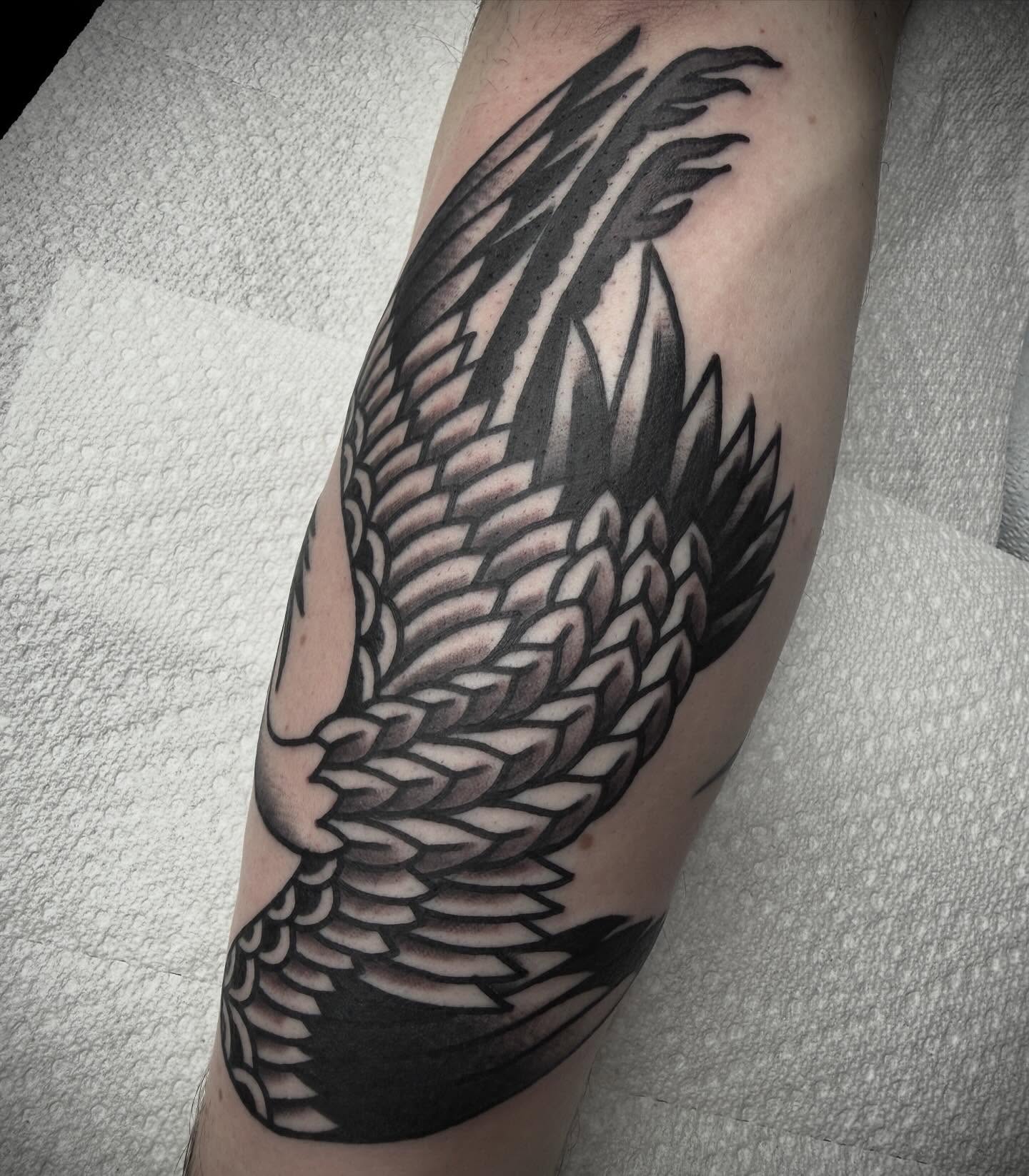 Wing black and grey tattoo on the forearm by Tristan Bradshaw