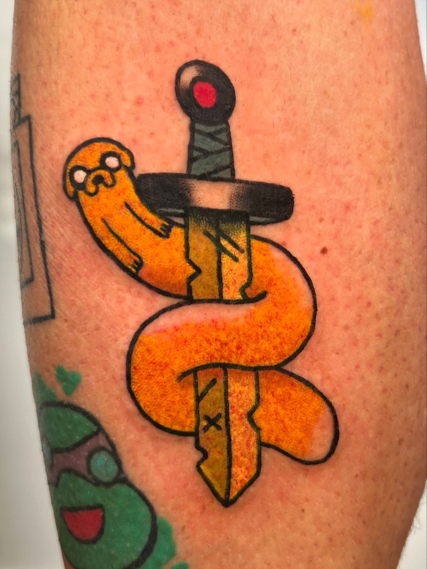 Snake and dagger American traditional tattoo on the forearm by Ollie