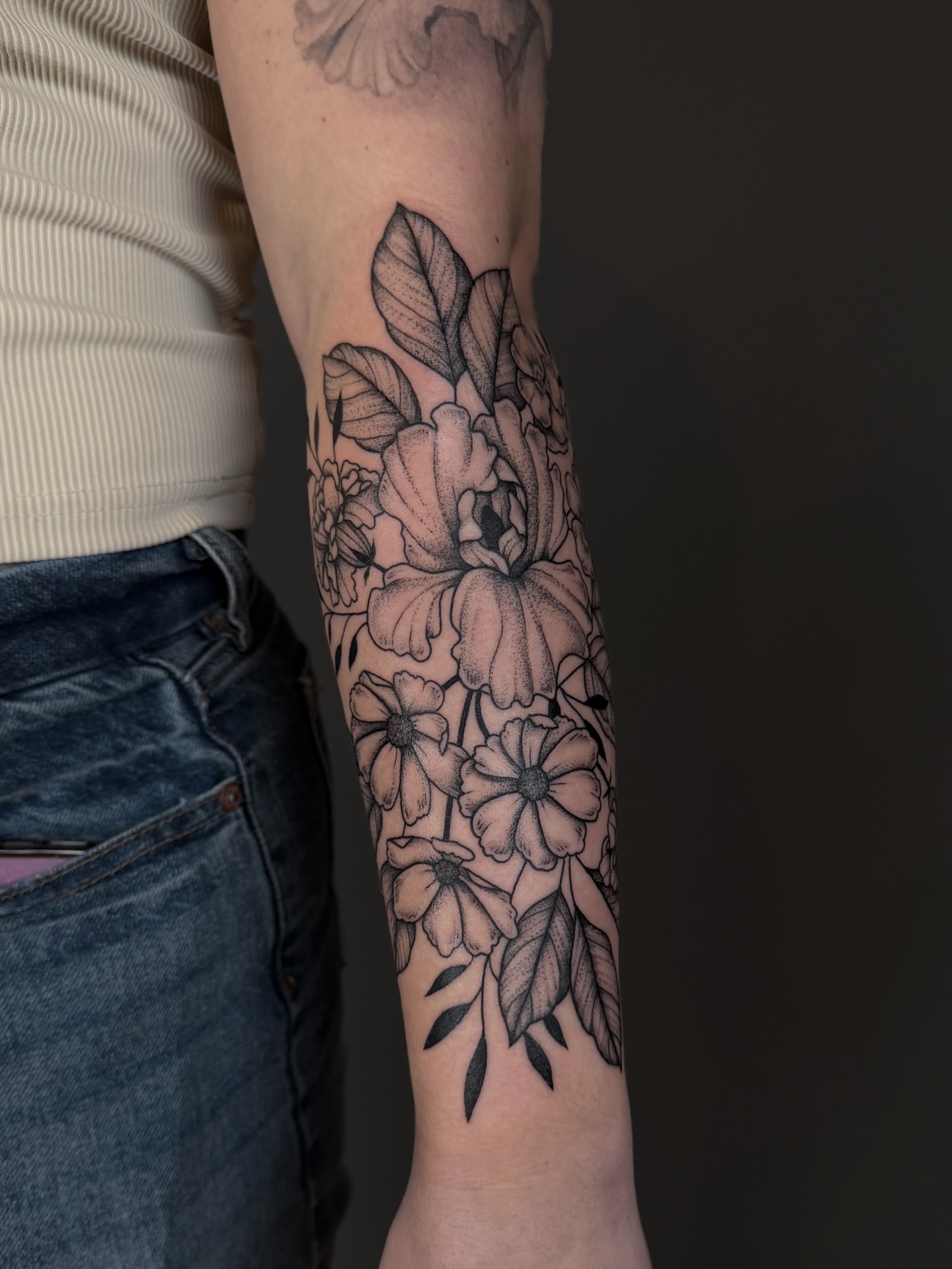 Floral bouquet black and grey tattoo on the forearm by Hannah, Portland, Oregon
