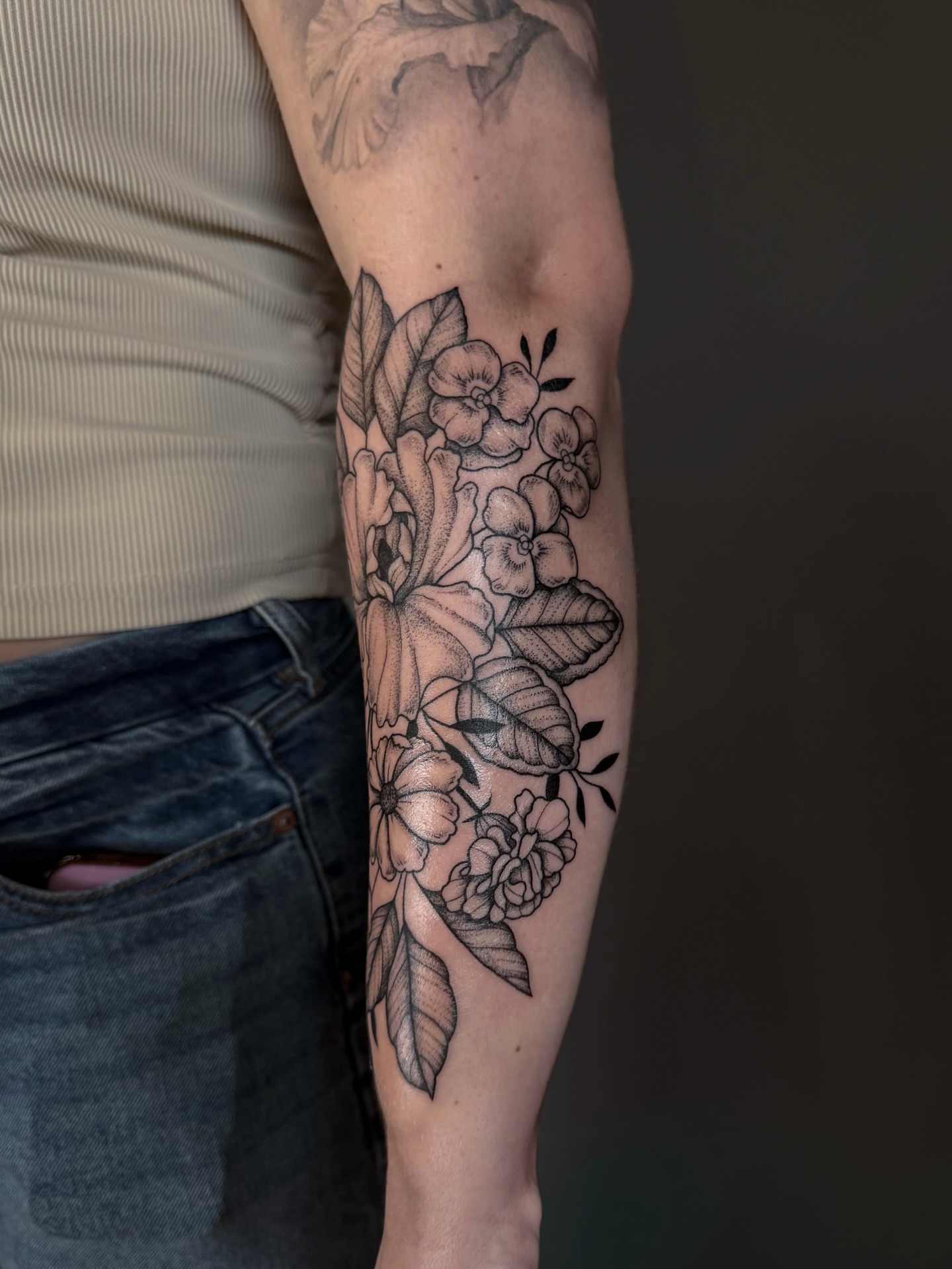Floral bouquet black and grey tattoo on the forearm by Hannah, Portland, Oregon