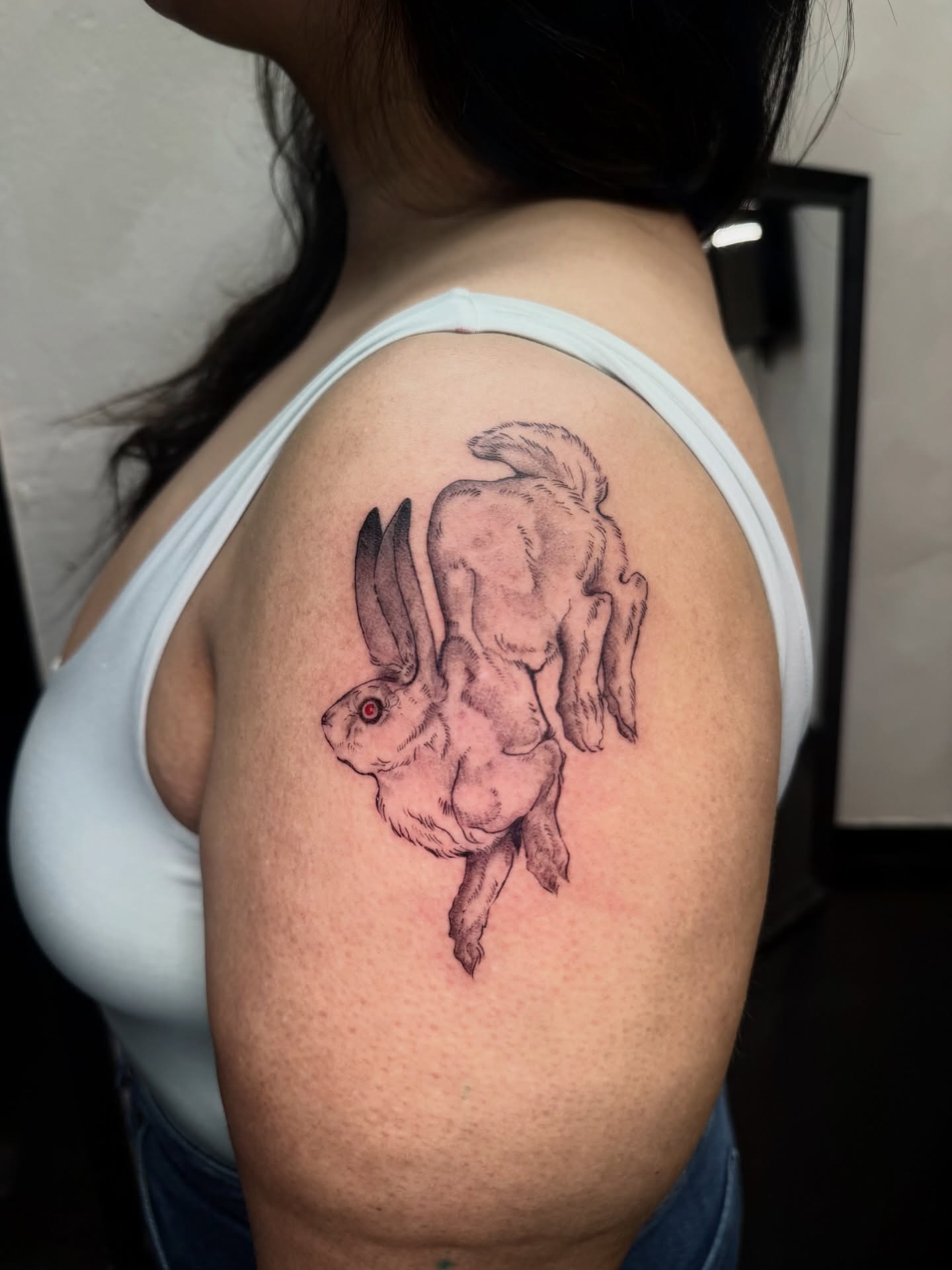 Rabbit realism tattoo on the shoulder by Bryan Nguyen