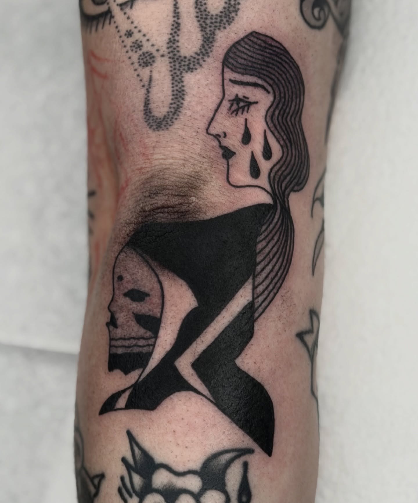 Woman crying black and grey tattoo on the forearm by Maks