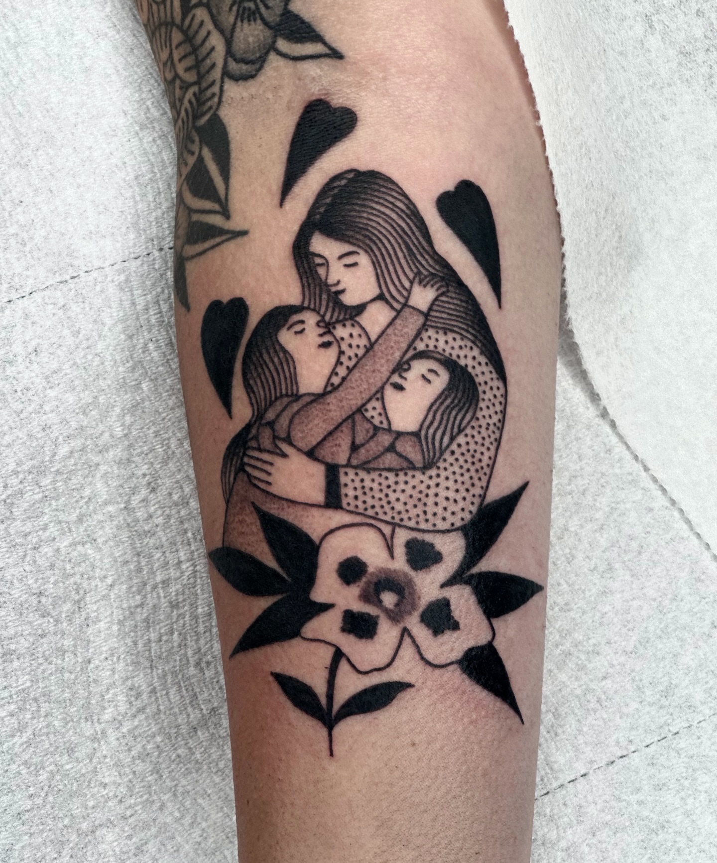 Mother and children black and grey tattoo on the forearm by Maks