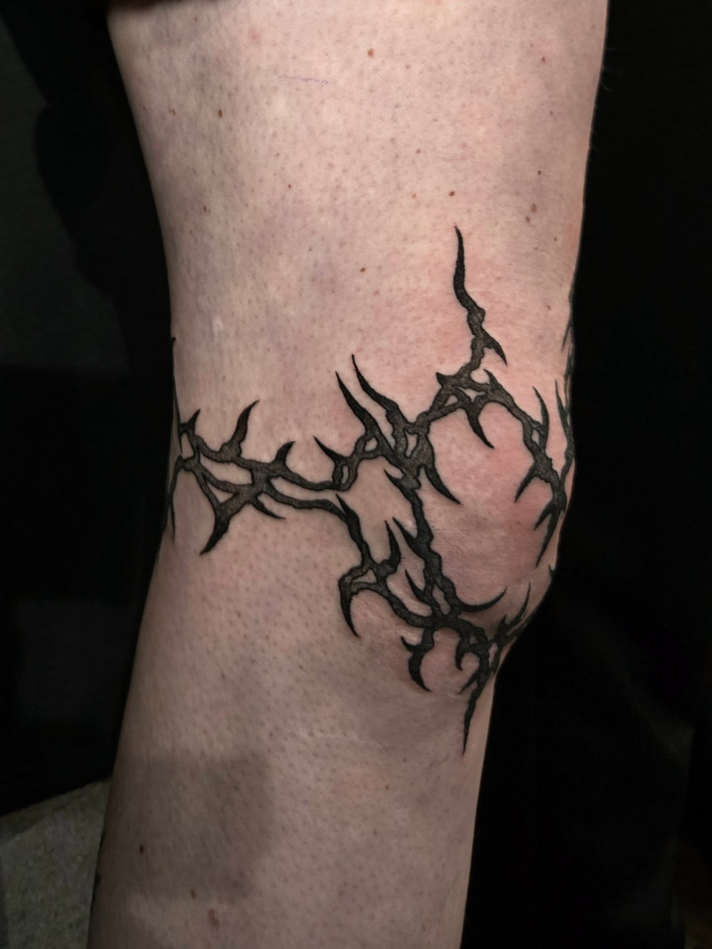 Thorn crown black and grey tattoo on the forearm by Perry