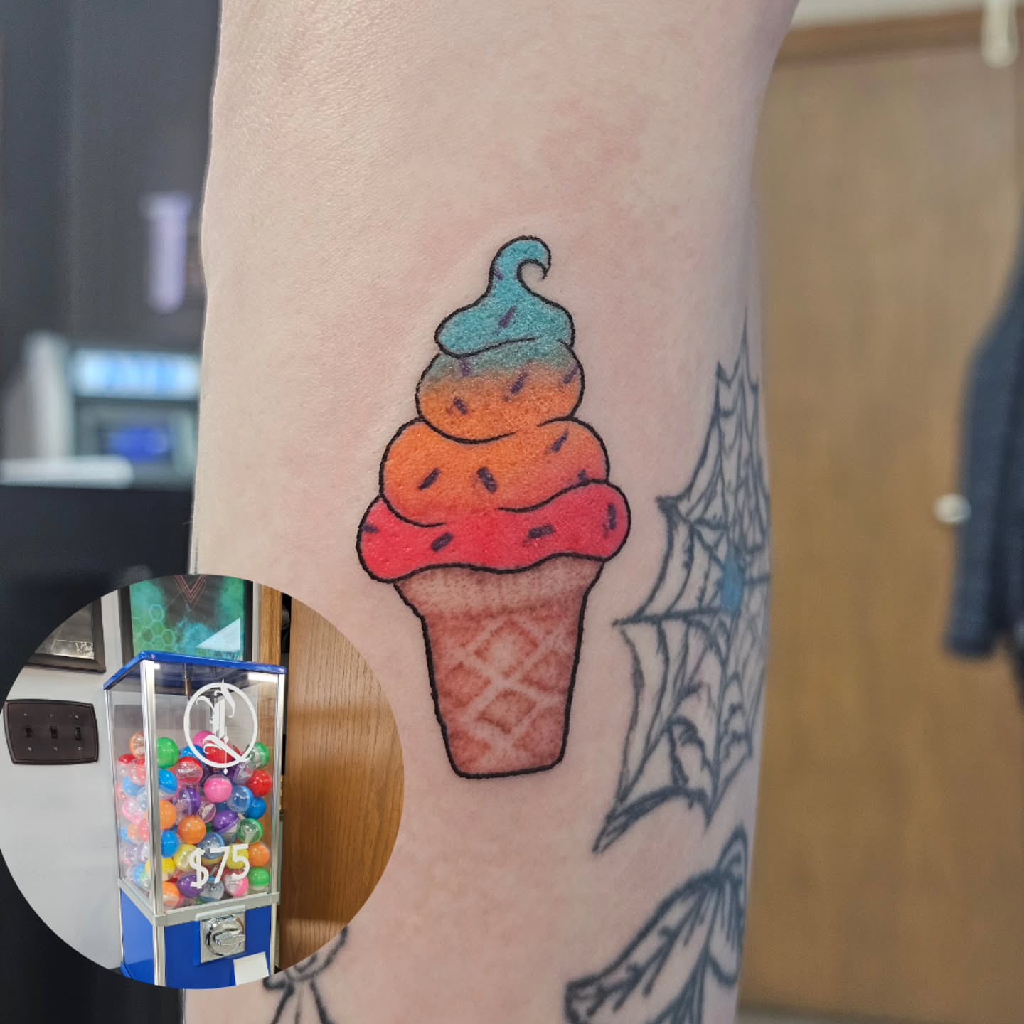 Ice cream cone watercolor tattoo on the forearm by Damian Eames