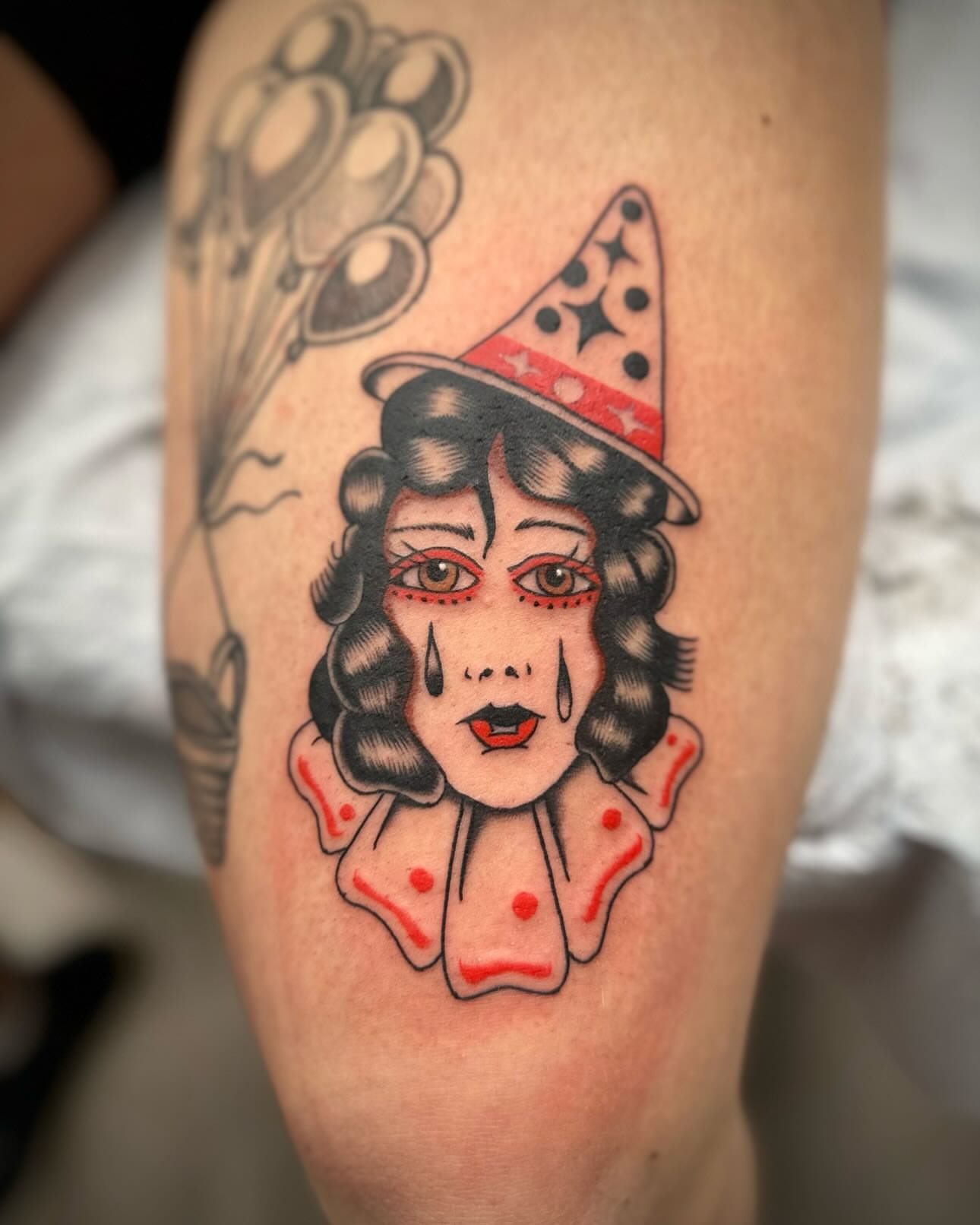 Clown American traditional tattoo on the forearm by rory