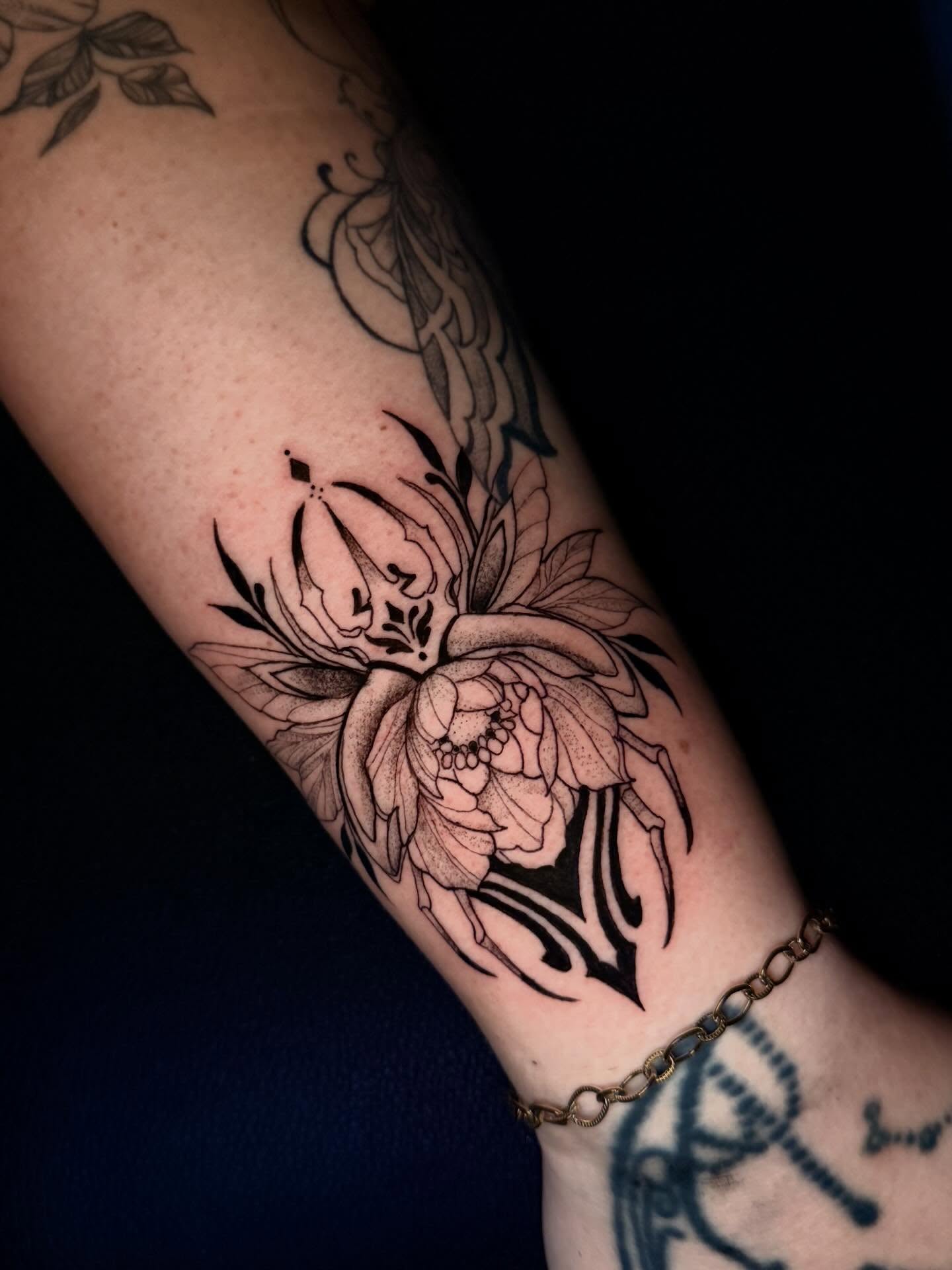 Lotus flower black and grey tattoo on the forearm by ᴍᴀɢɢɪᴇ ✧, Las Vegas, Nevada