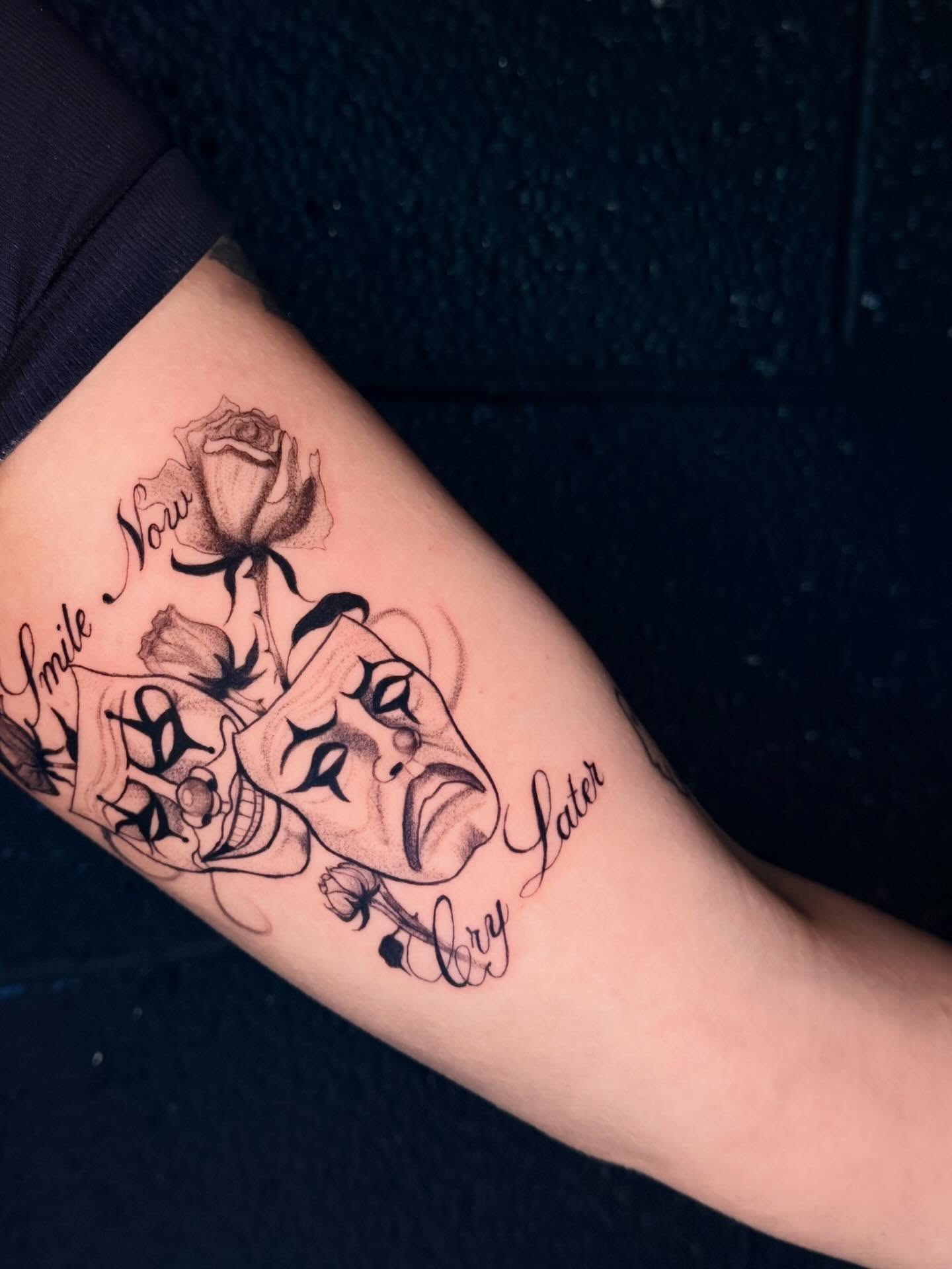 Theater masks and rose black and grey tattoo on the forearm by ᴍᴀɢɢɪᴇ ✧, Las Vegas, Nevada
