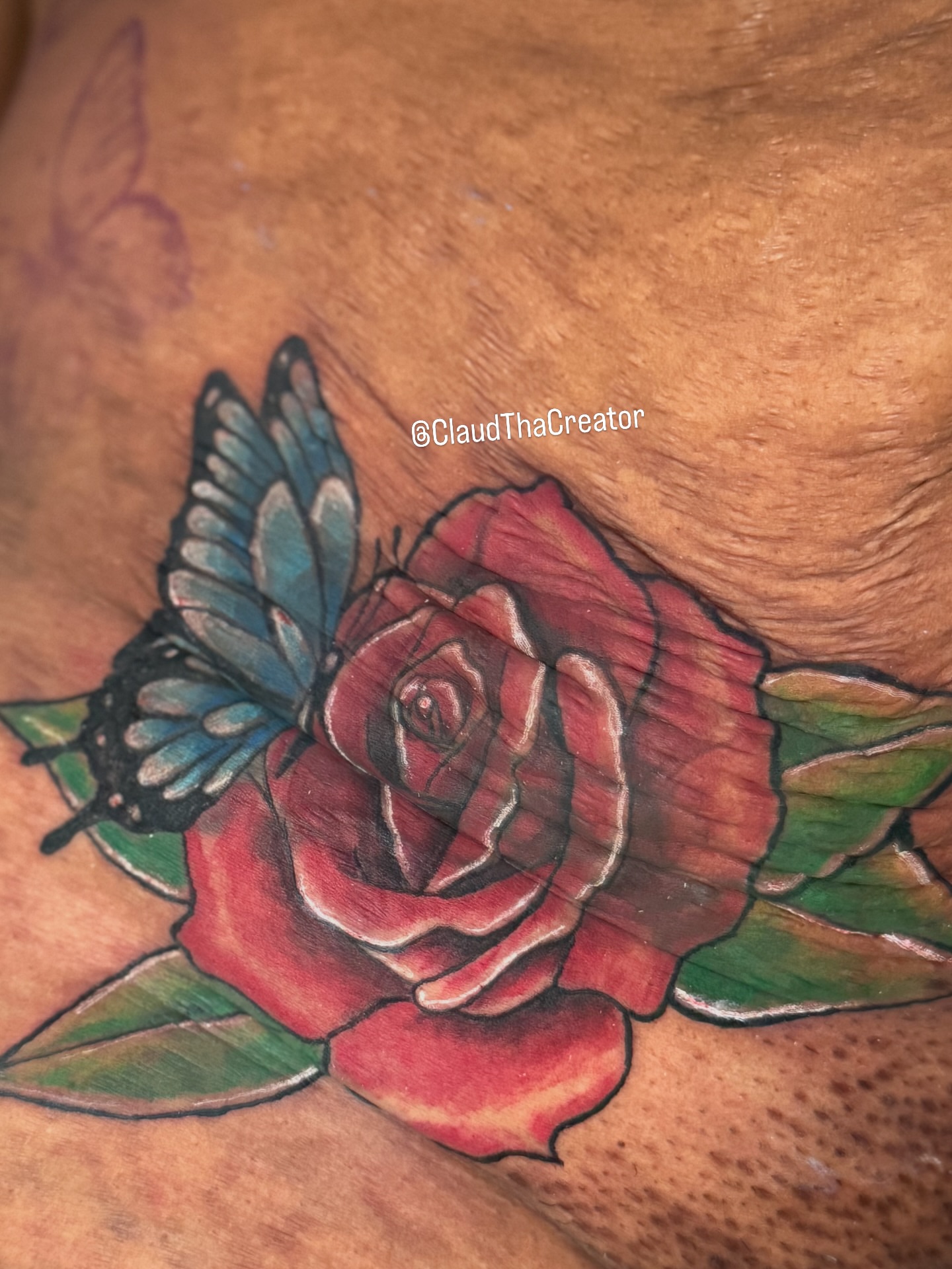 Rose and butterfly American traditional tattoo on the thigh by claud, Atlanta, Georgia
